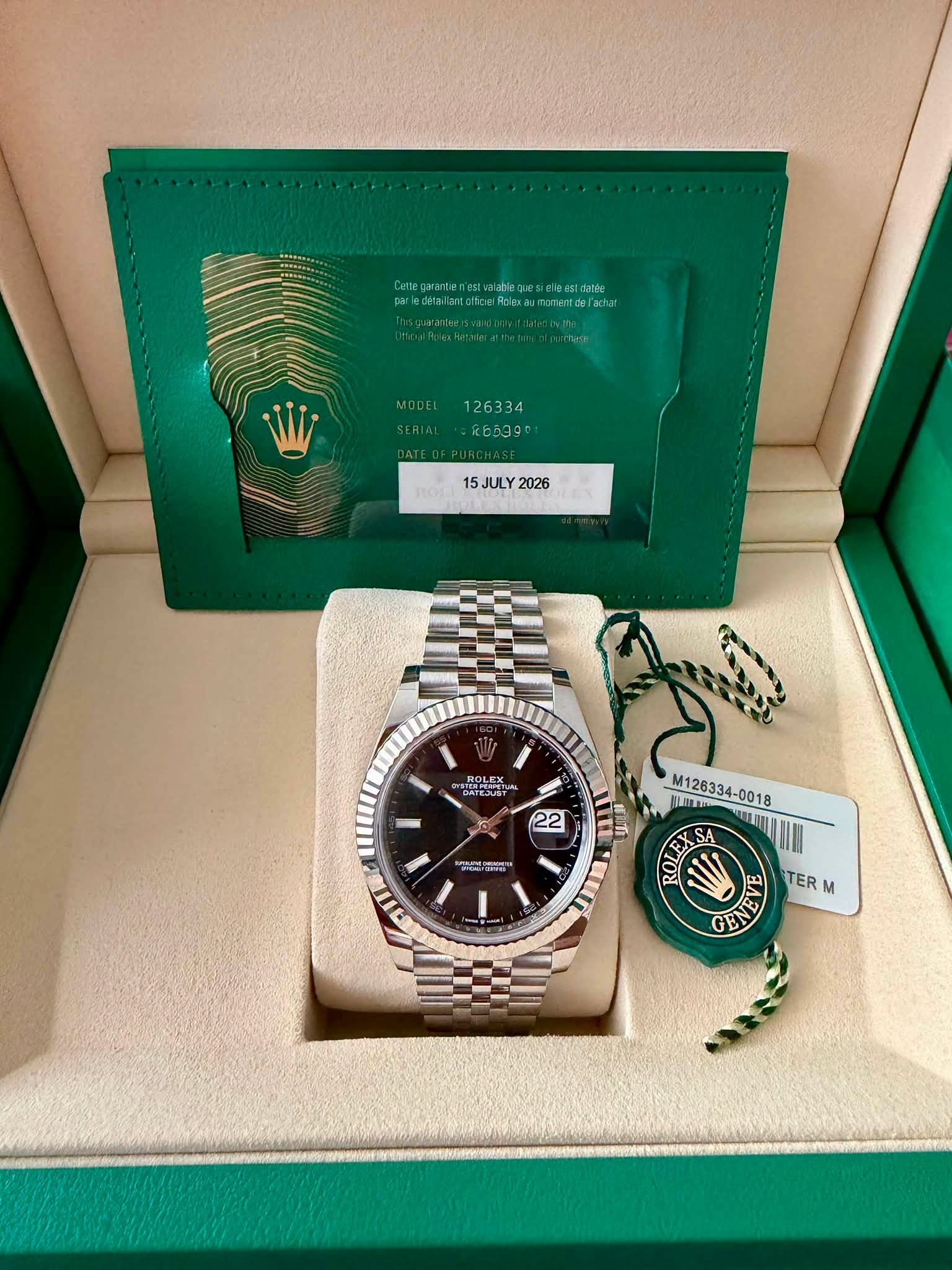 May be an image of wrist watch and text