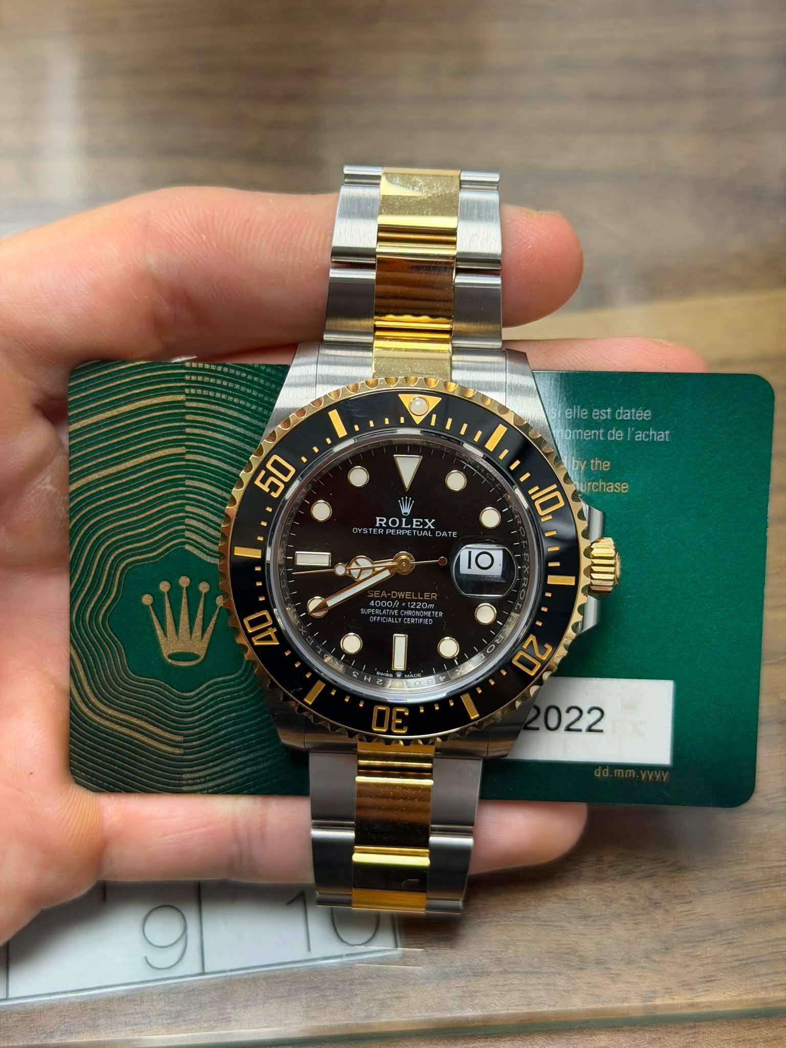 May be an image of wrist watch and text that says '50 elle elleestdatee est datee oment noment.del'achat ment de achat the the 10 rchase ROLEX '