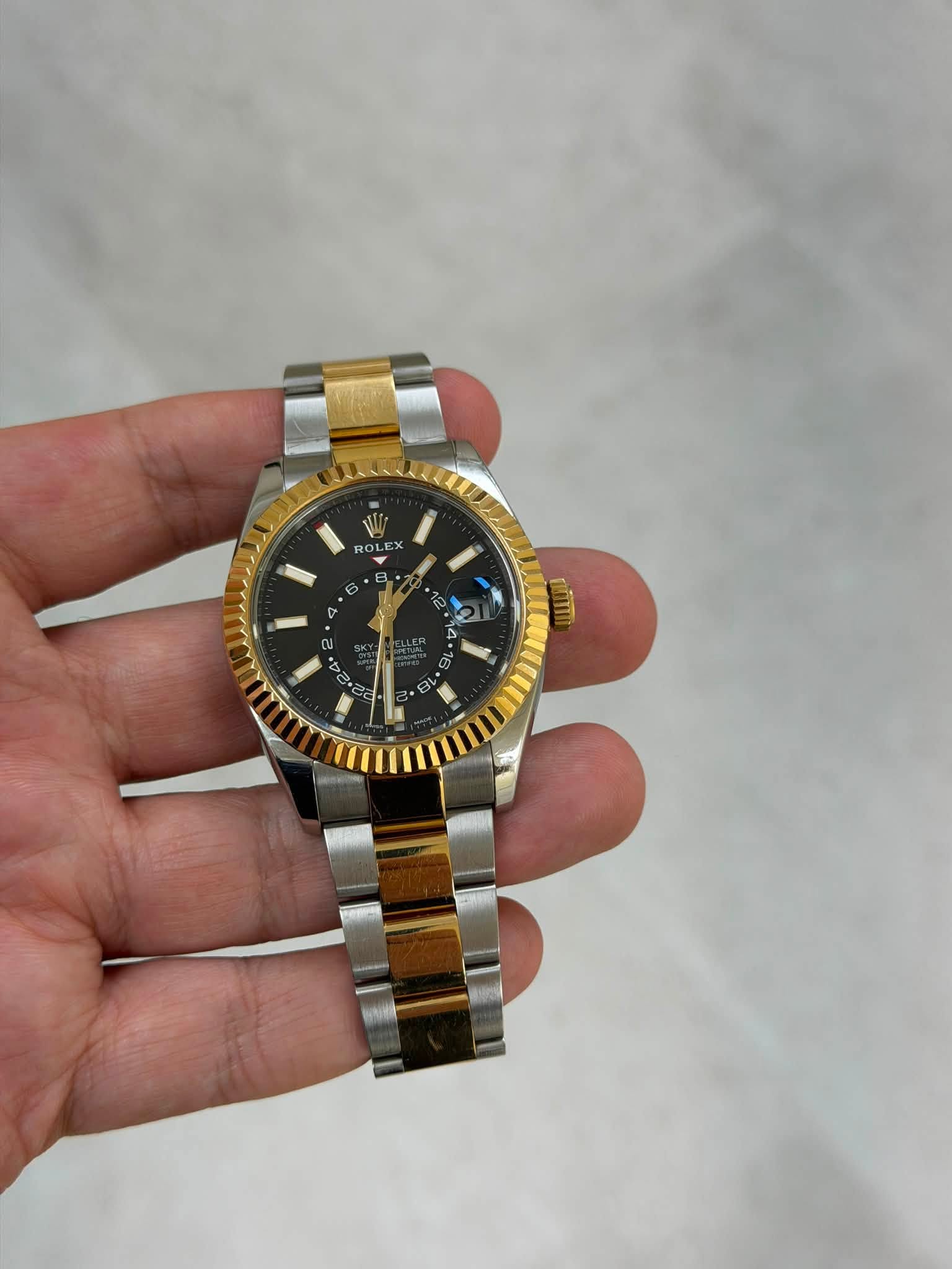 May be an image of wrist watch and text