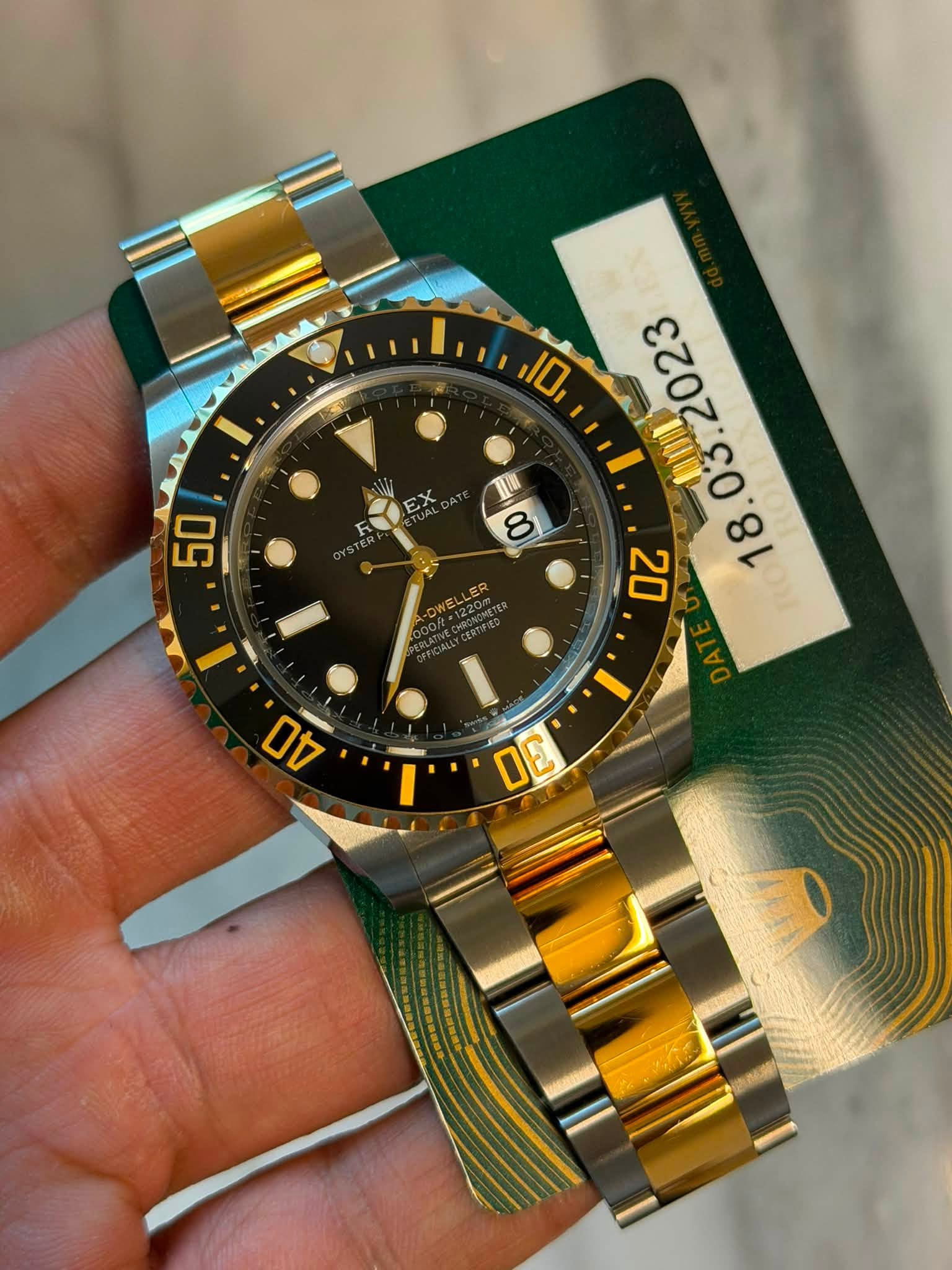 May be an image of wrist watch and text
