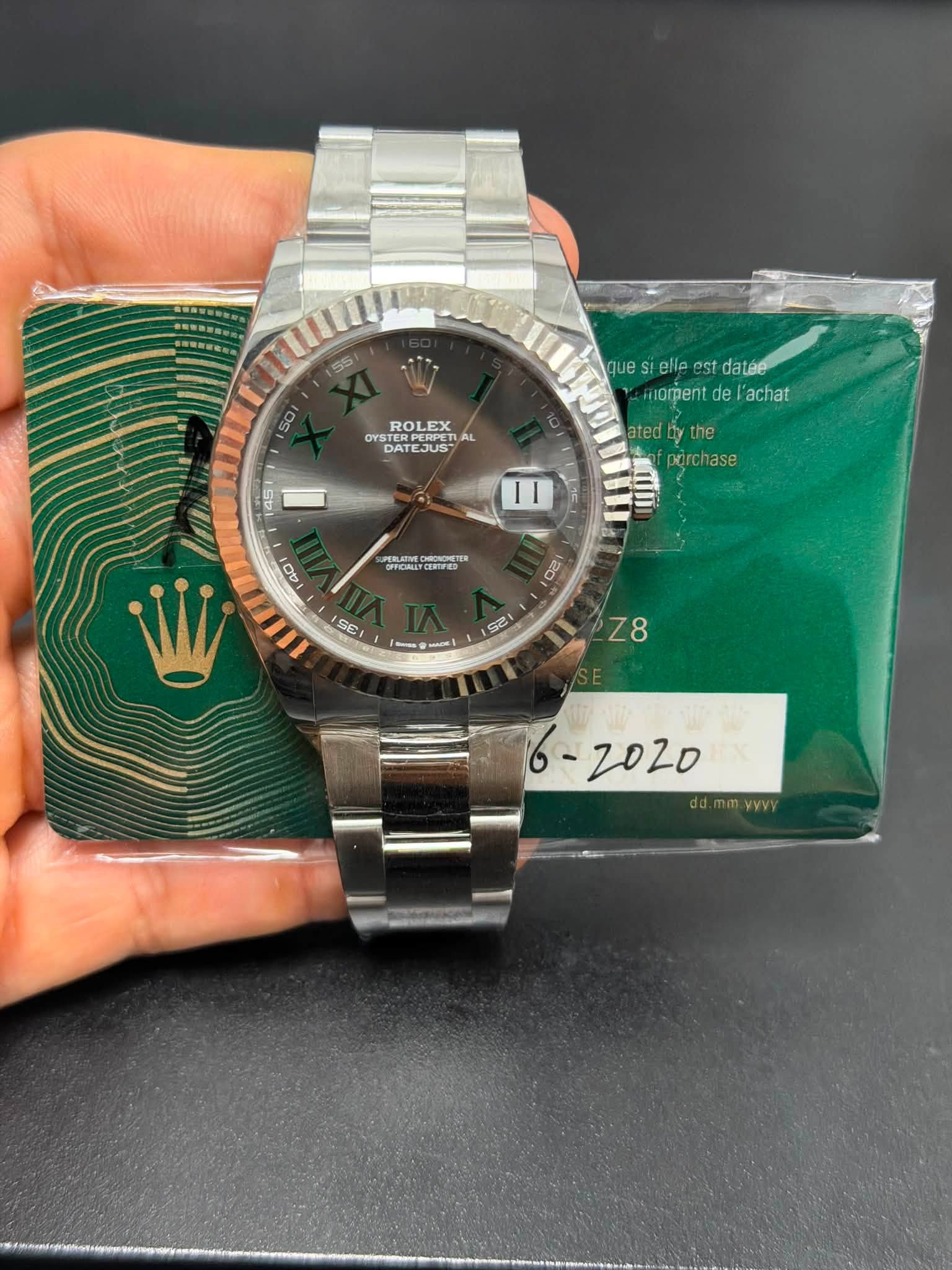 May be an image of wrist watch and text