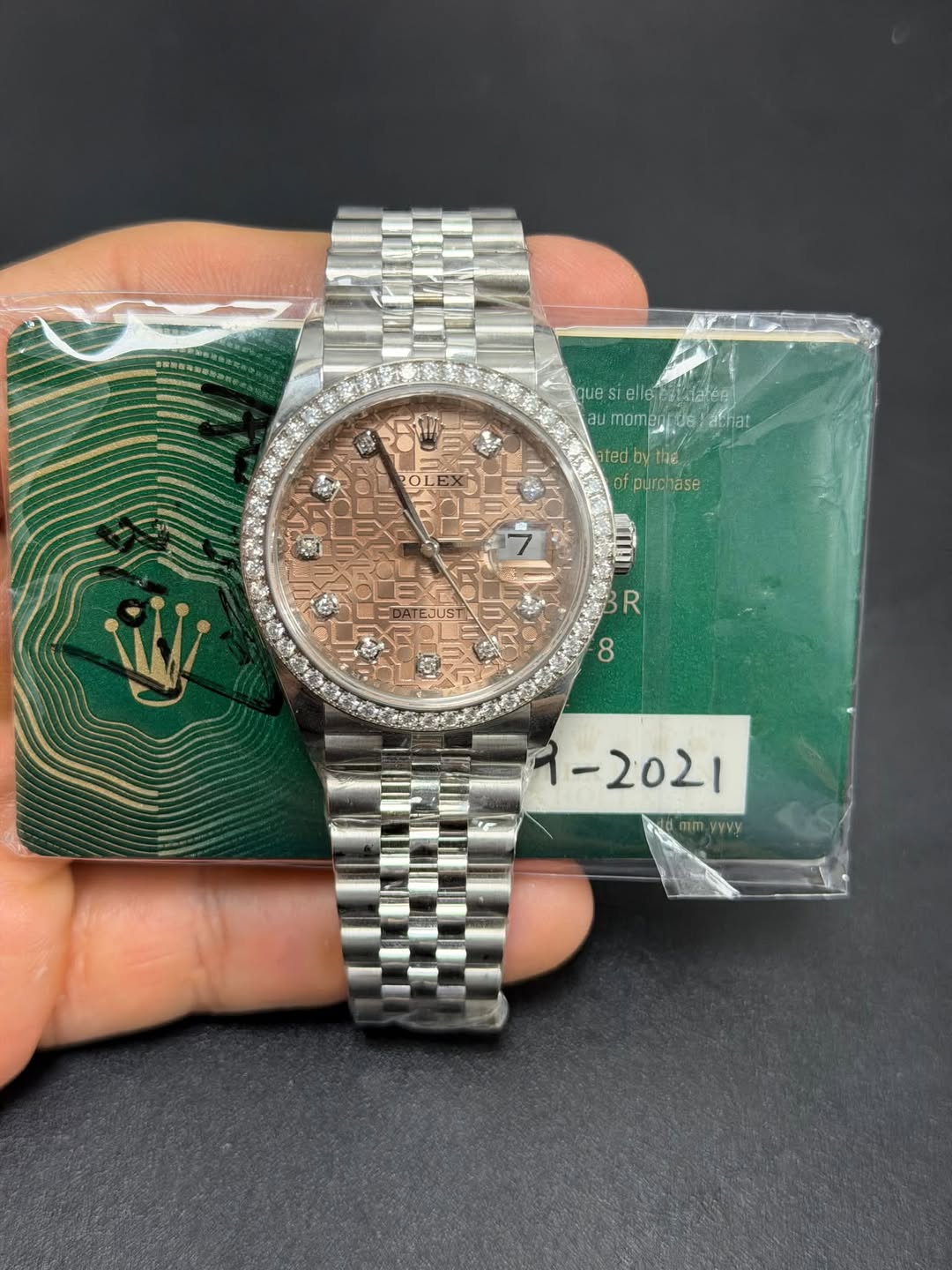 May be an image of wrist watch and text