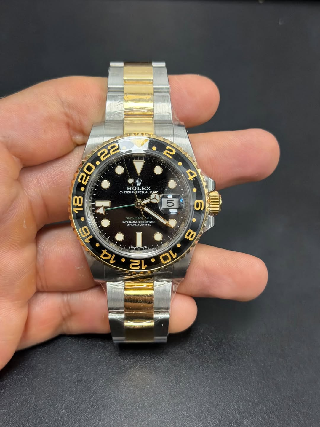 May be an image of wrist watch and text