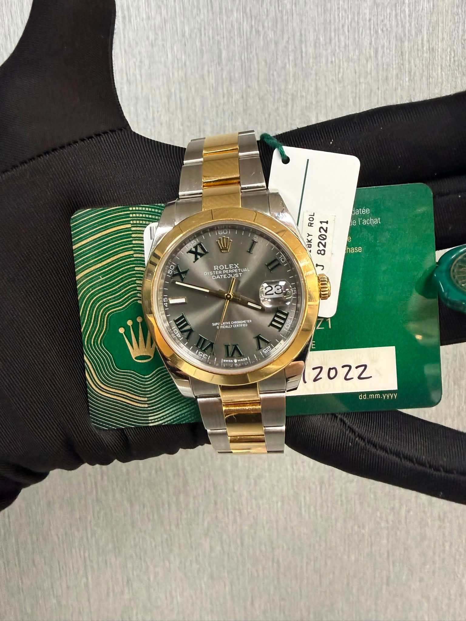 May be an image of wrist watch and text that says 'DU datée el 'achat V 50 RO ROLEA LEX ATE- STETEJUST TERPEHIT e hase 10 ROL 82021 BKY J በሰ 145 23. AOI 351 س 三 o ك E 2022 dd.…