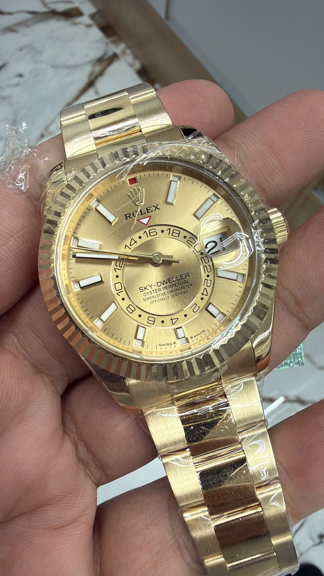 May be an image of wrist watch and text