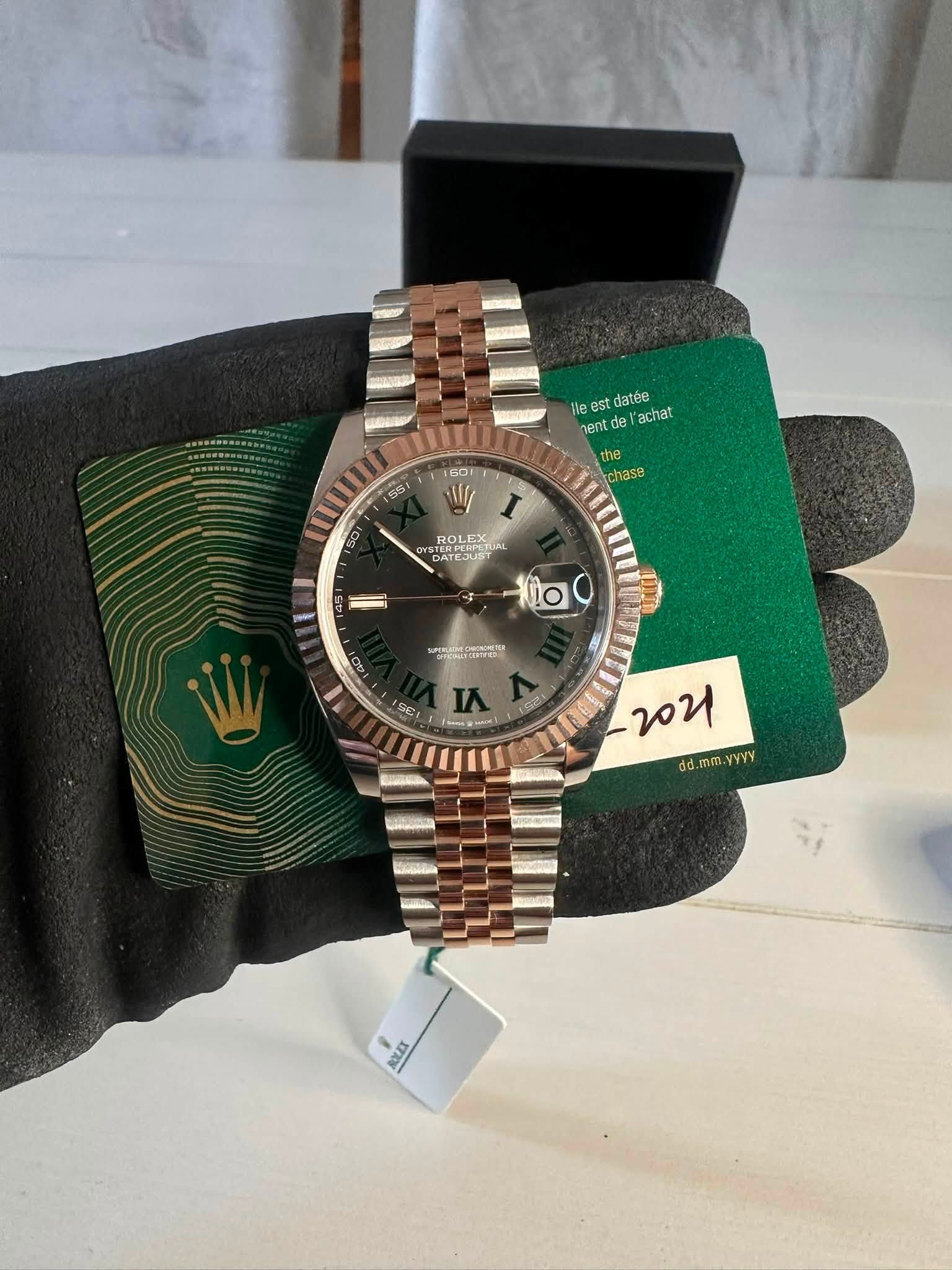 May be an image of wrist watch and text