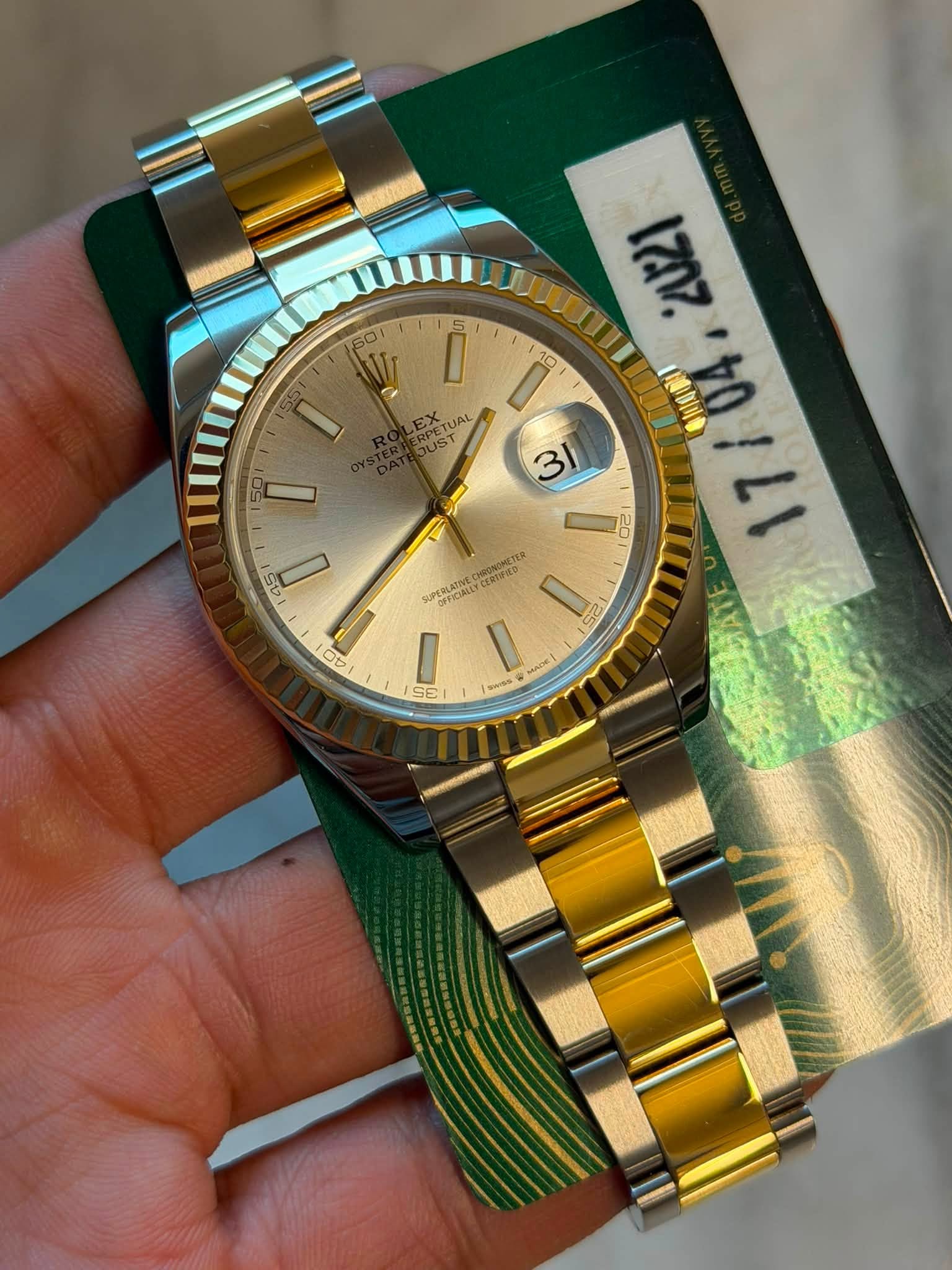 May be an image of wrist watch and text