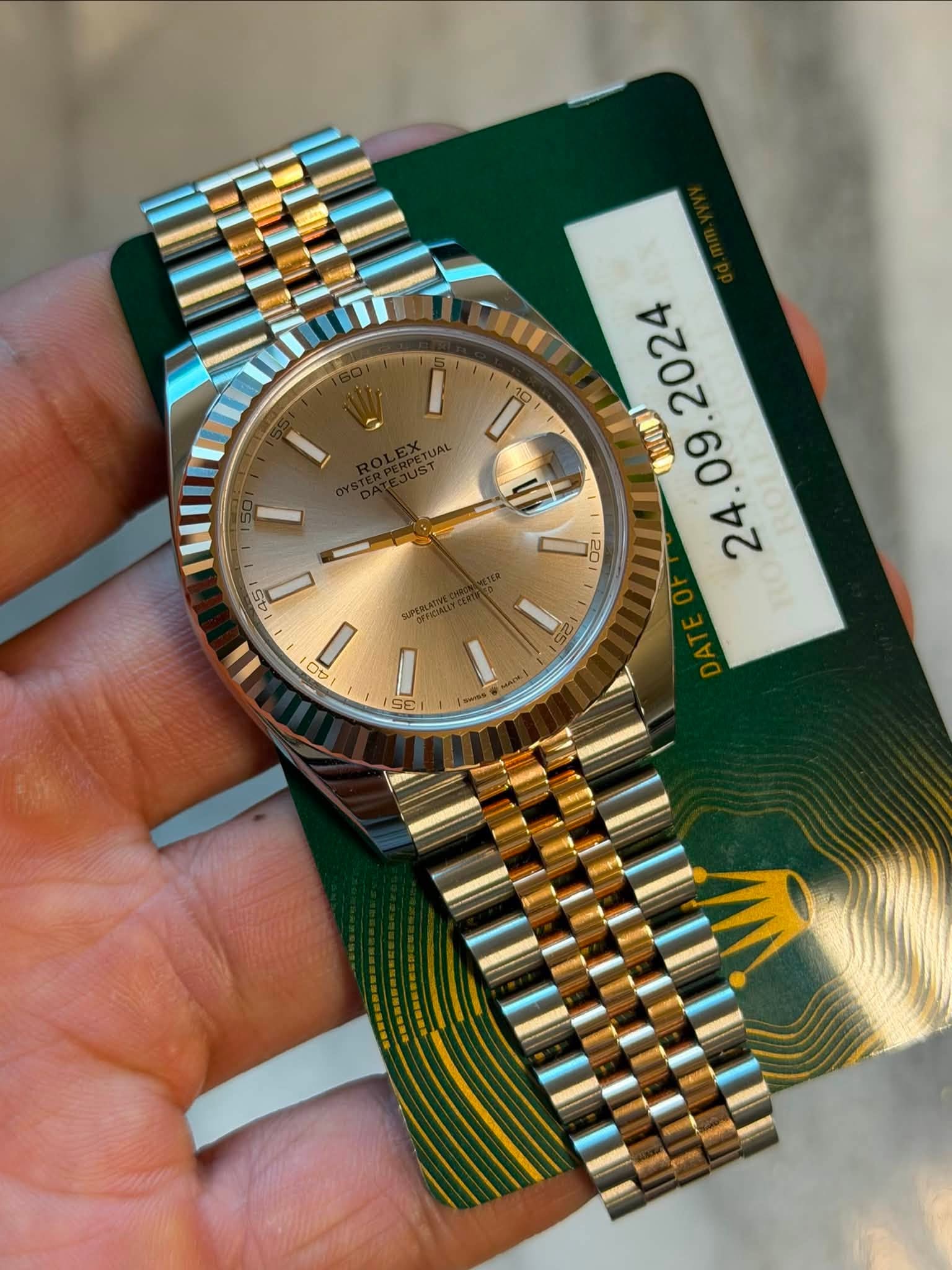 May be an image of wrist watch and text