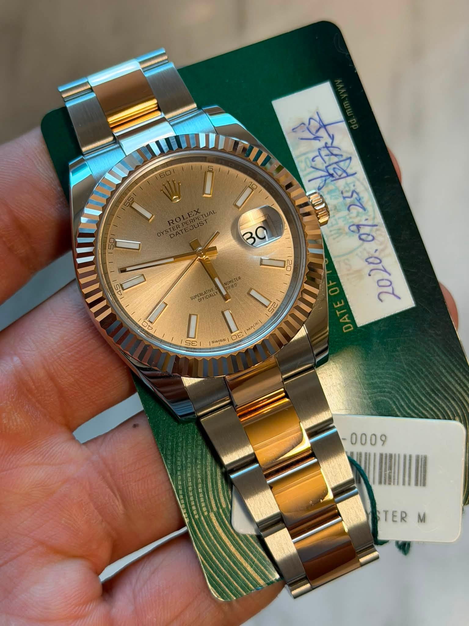 May be an image of wrist watch and text