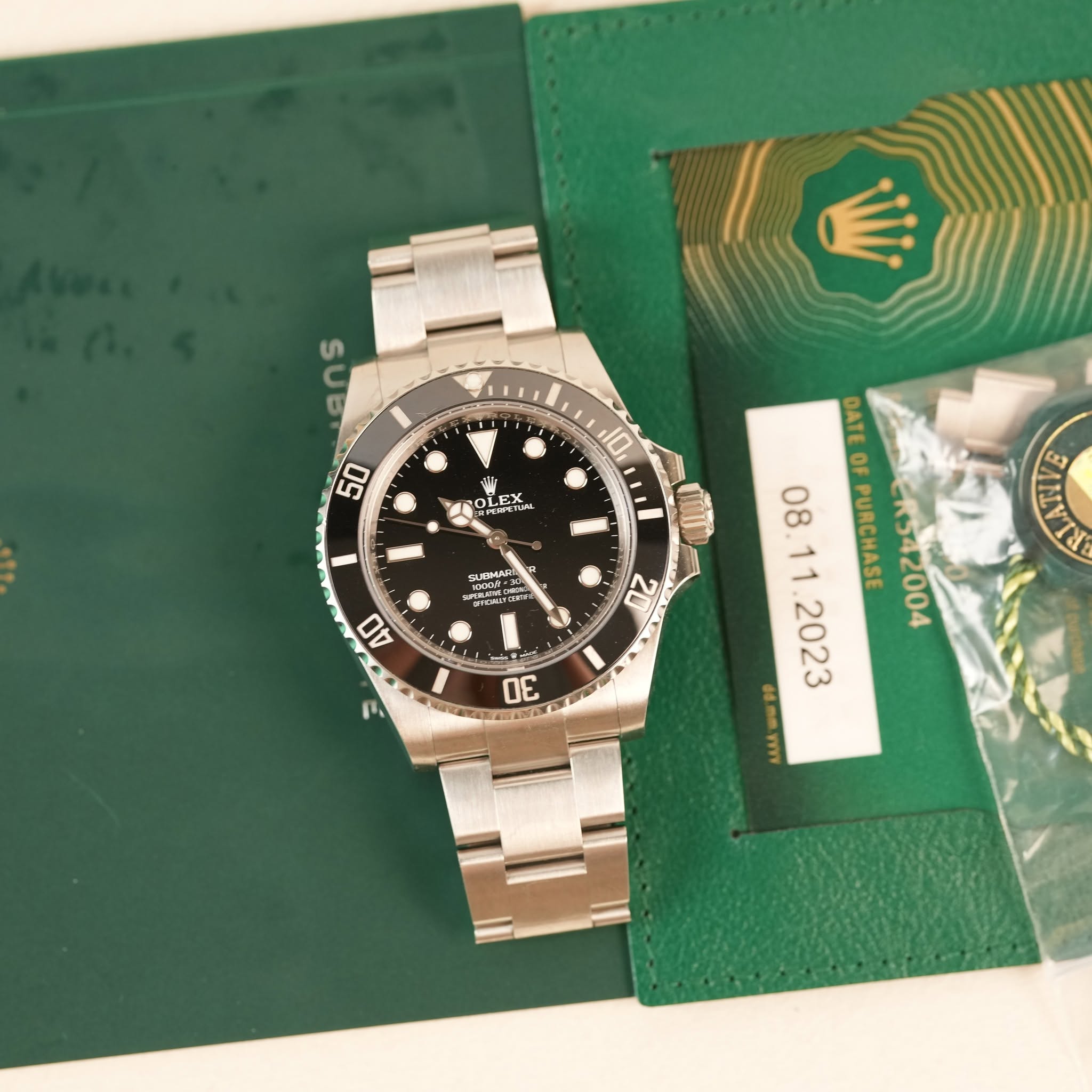 May be an image of wrist watch and text that says 'ans S 50 10 ""ក 통T축78 жa 40 N 20 ANIE DATEO DATEOFPURCHASE OF PURCHASE 北R542004 2023 YIy n 30'