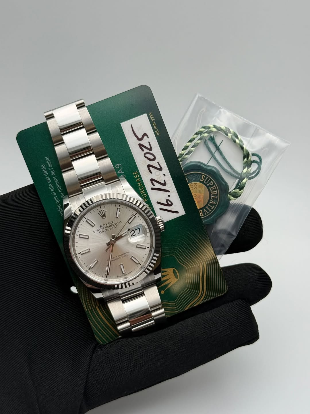 May be an image of wrist watch and text