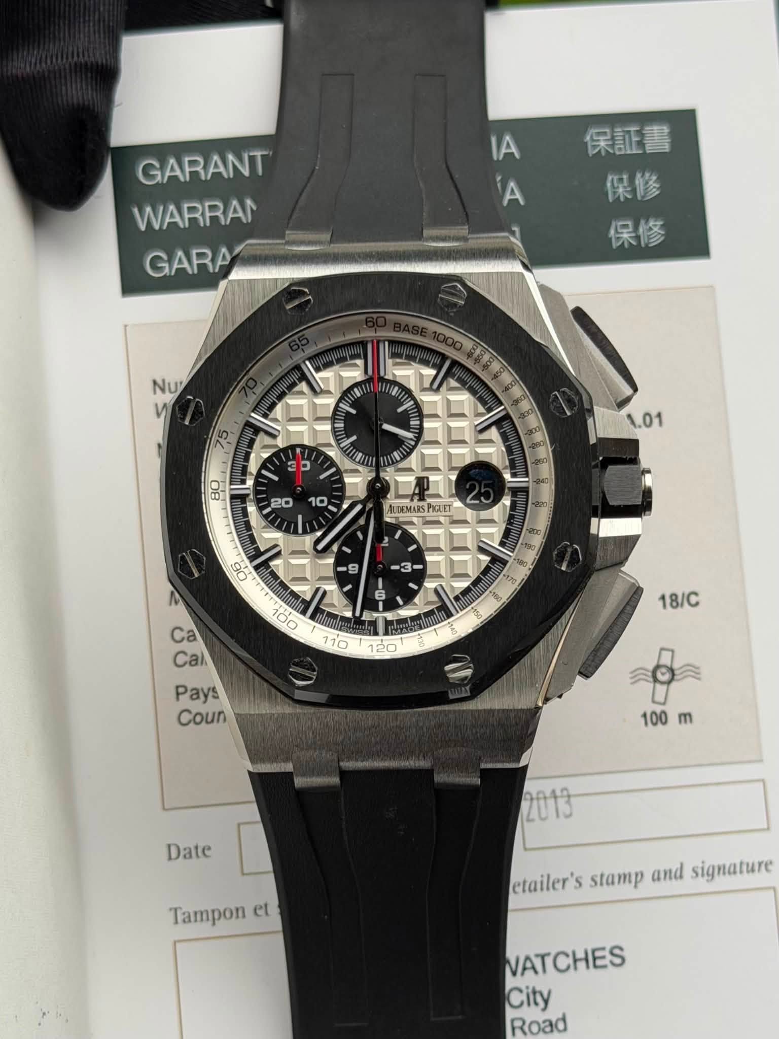 May be an image of wrist watch and text that says 'GARANT WARRAN GARA IA A 保証書 保修 保修 Nu V 75 1.01 M B0 20 10 LDEMARS POLIET s0 Ka 6 9 3 Ca Cal Pays Coun itolasisn teY 8 18/C 100…