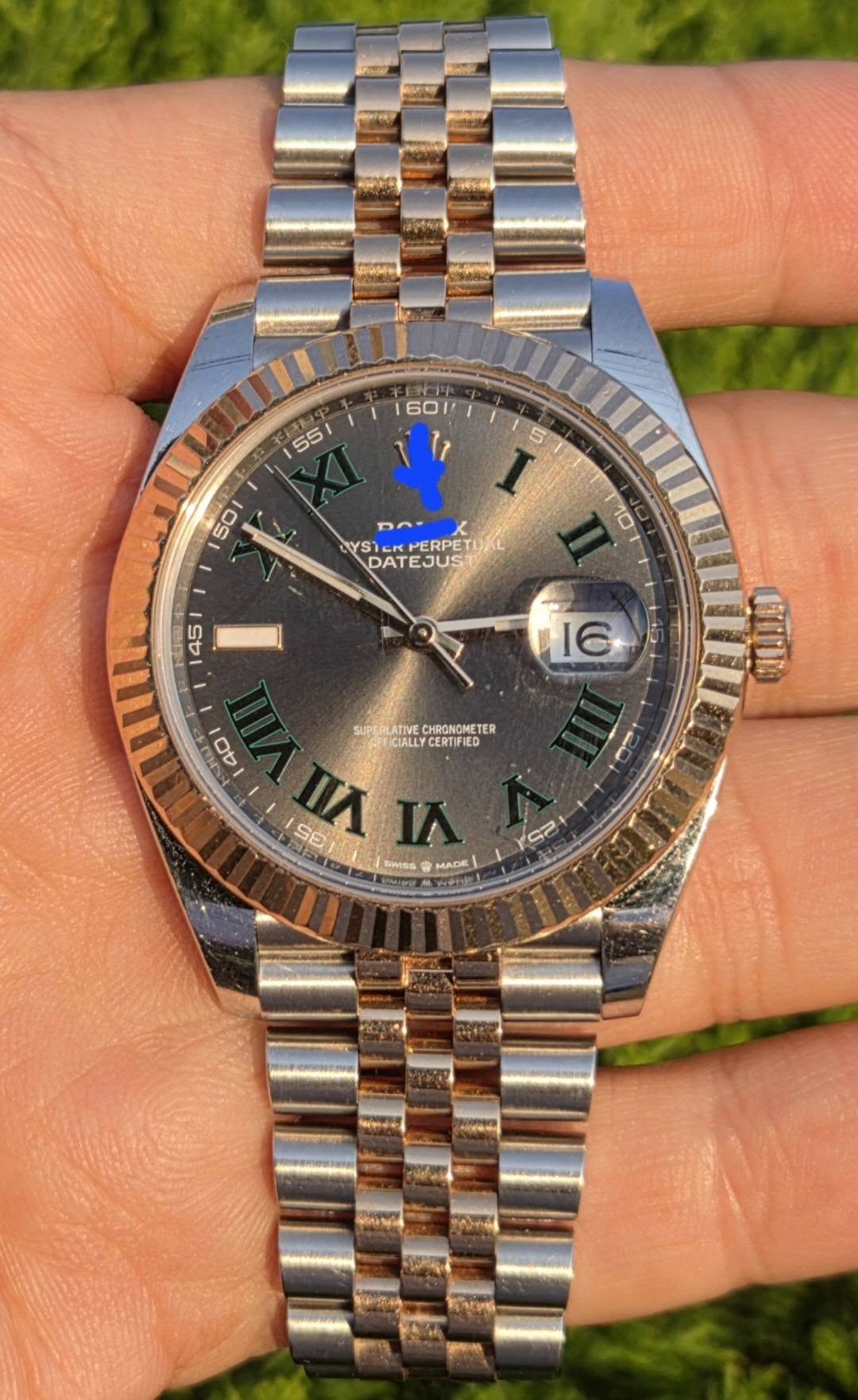 May be an image of wrist watch and text