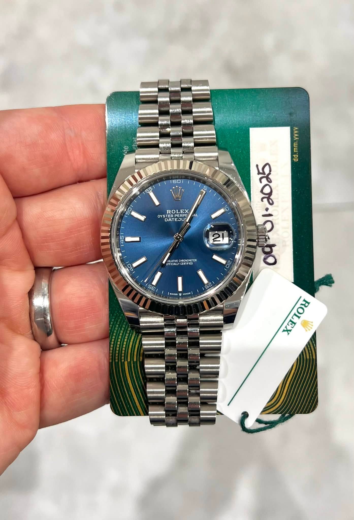 May be an image of wrist watch and text
