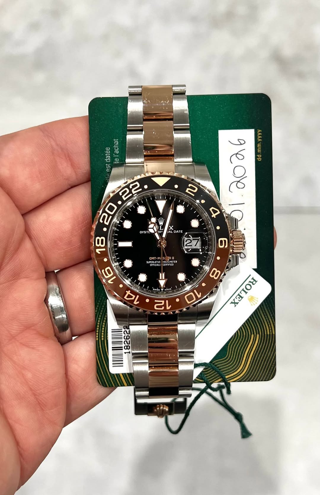 May be an image of wrist watch and text