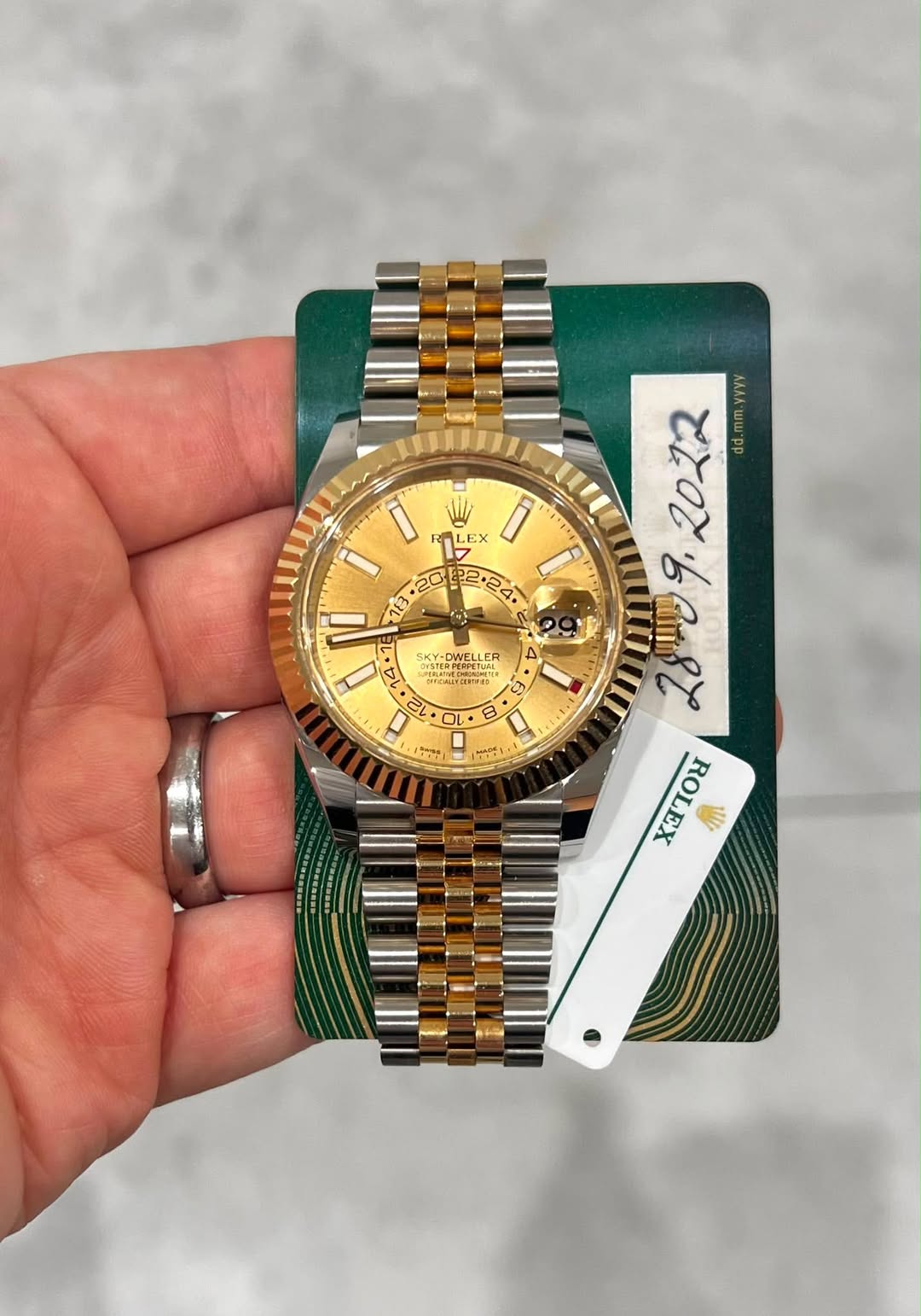 May be an image of wrist watch and text