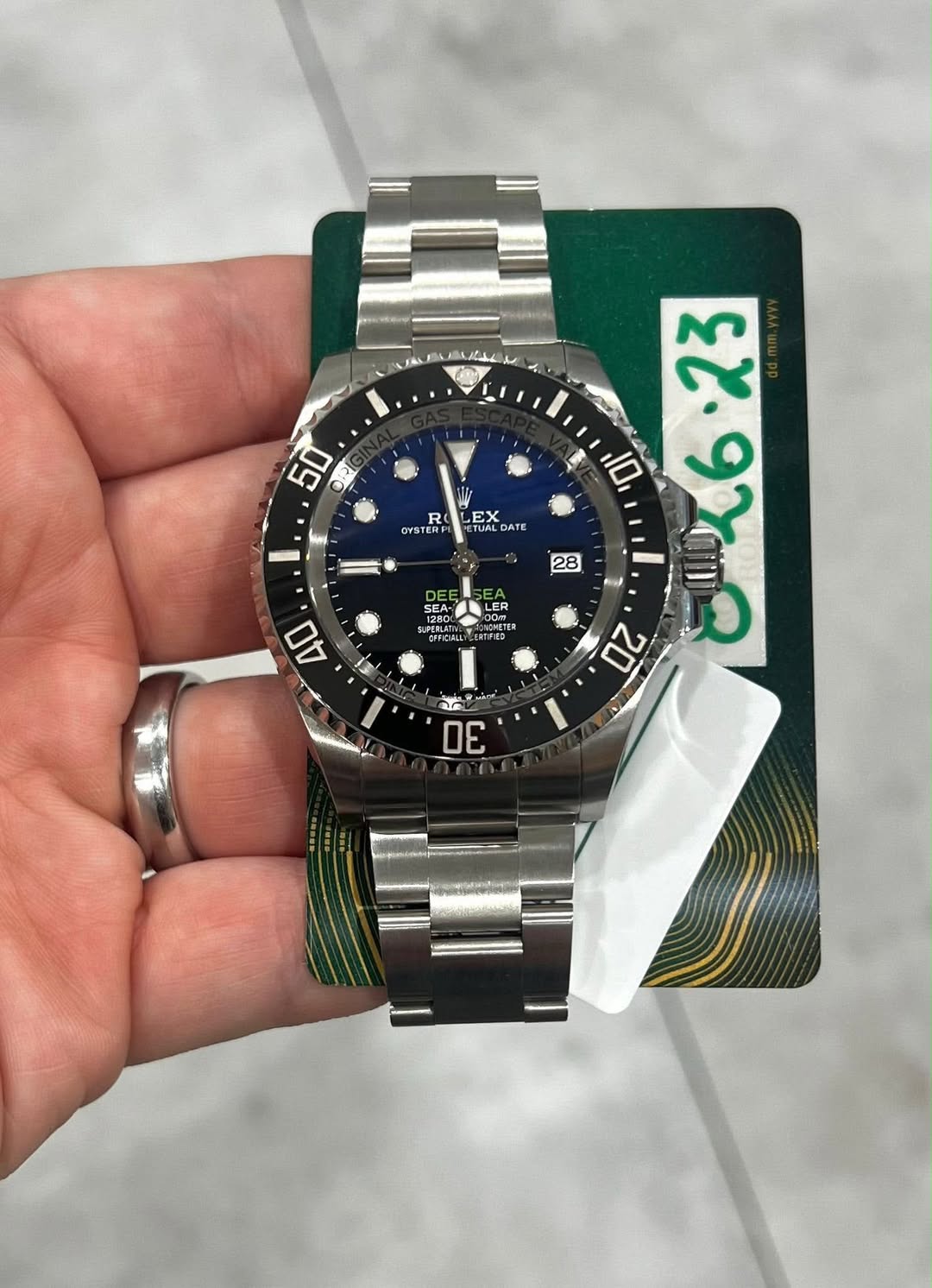 May be an image of wrist watch and text
