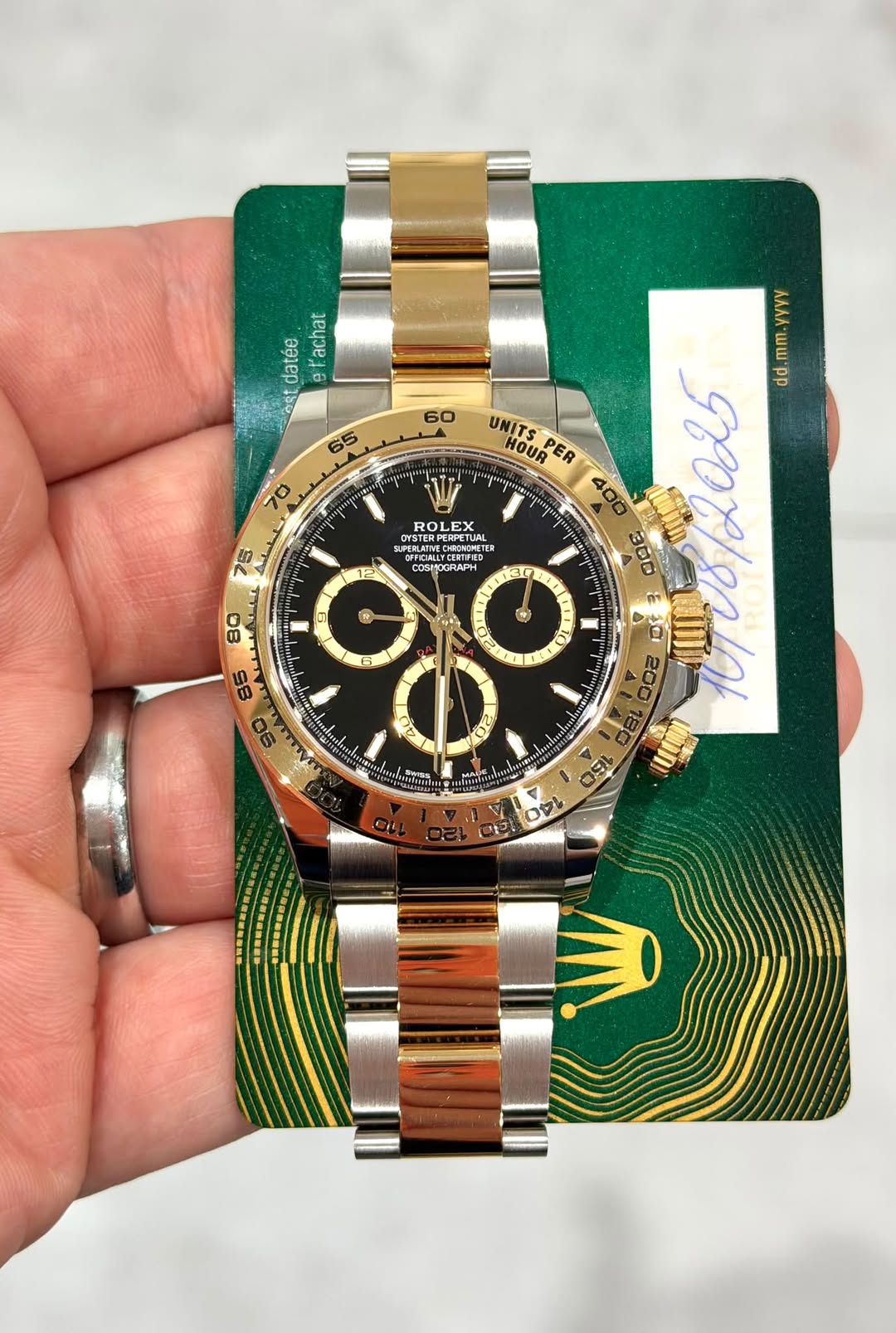 May be an image of wrist watch and text