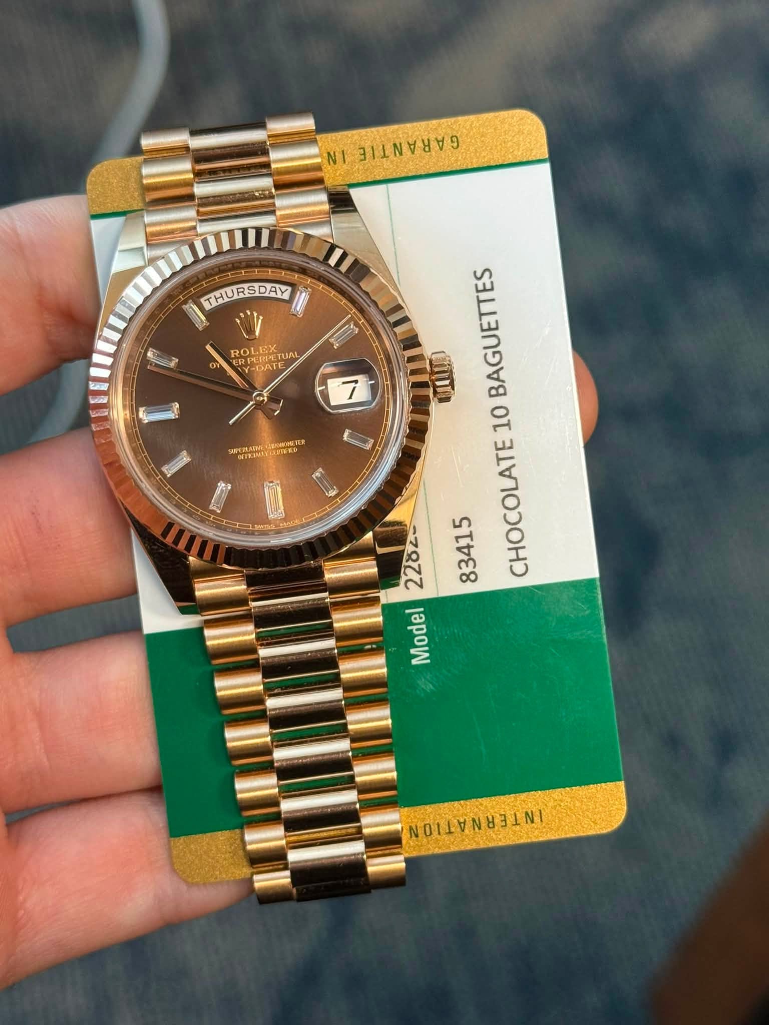 May be an image of wrist watch and text
