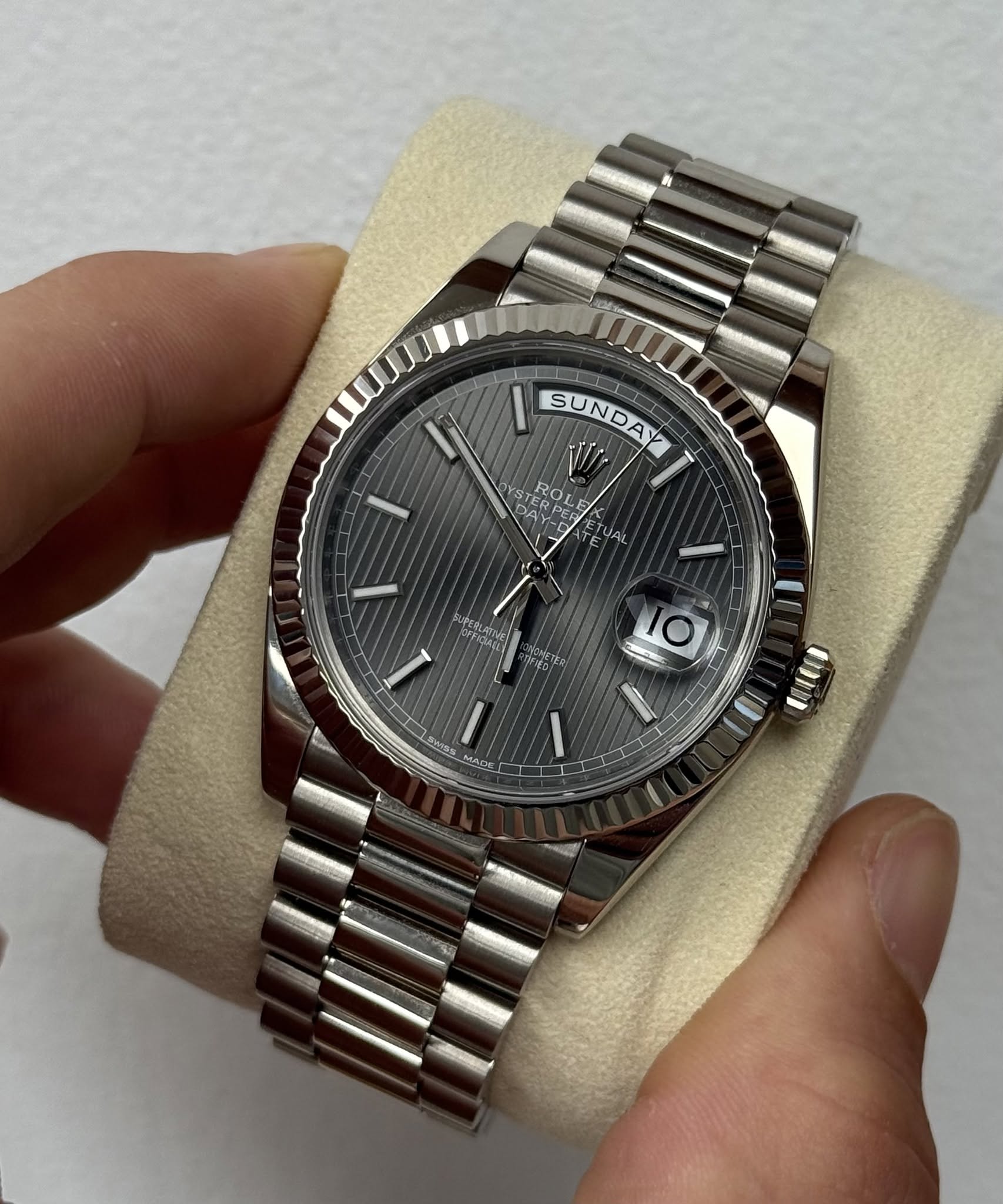 May be an image of wrist watch and text