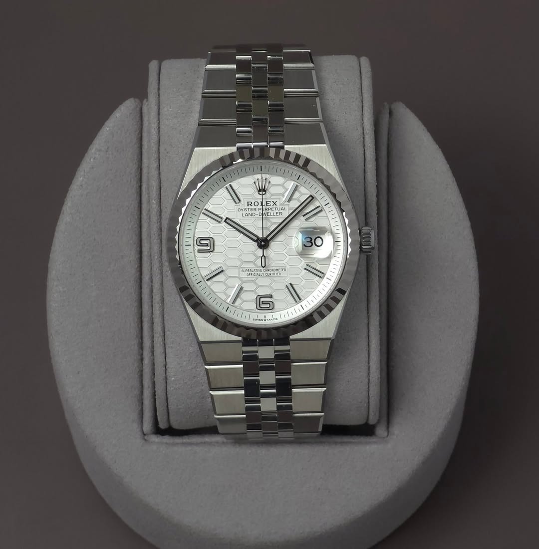 May be an image of wrist watch and text