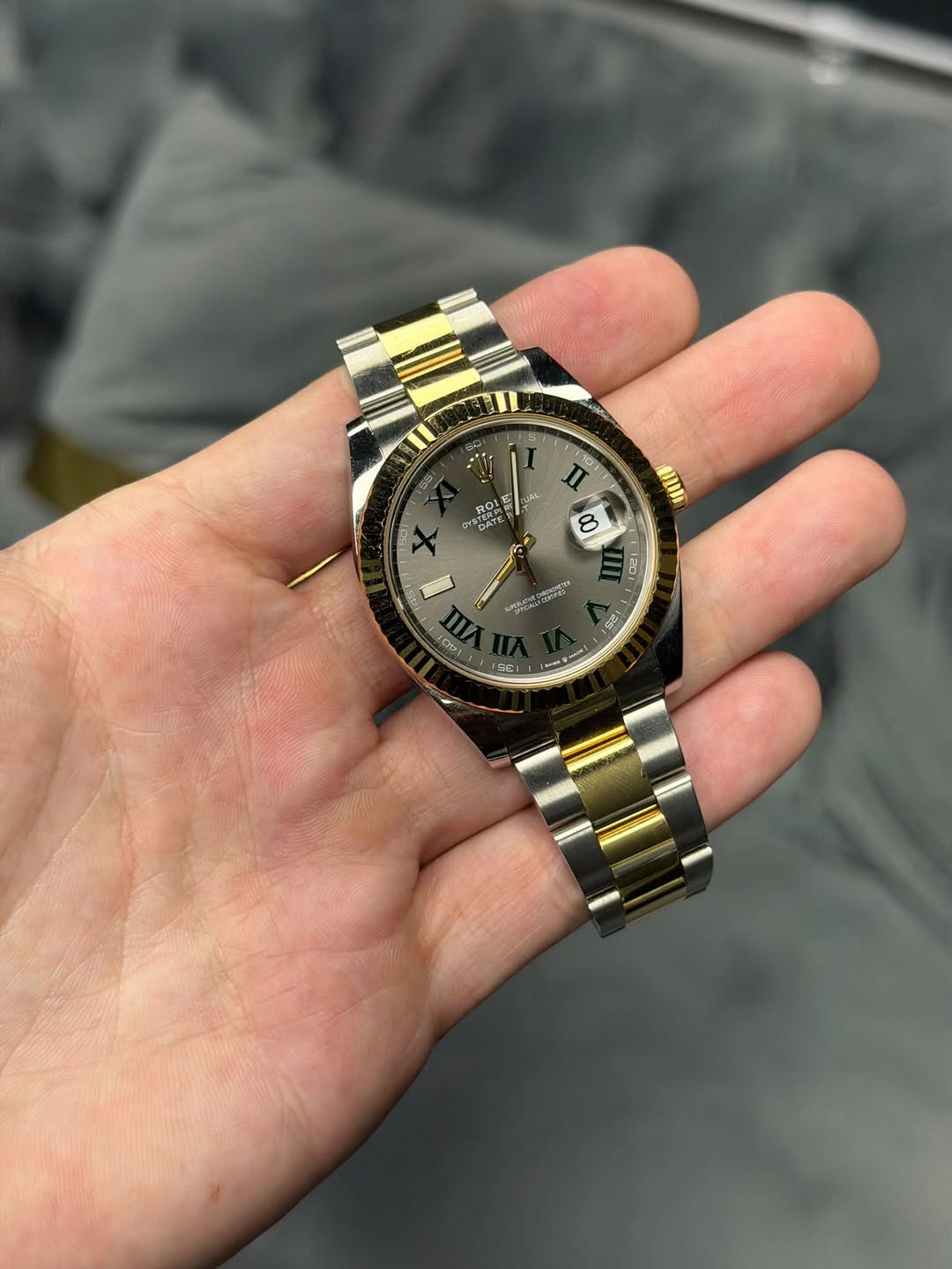 May be an image of wrist watch and text