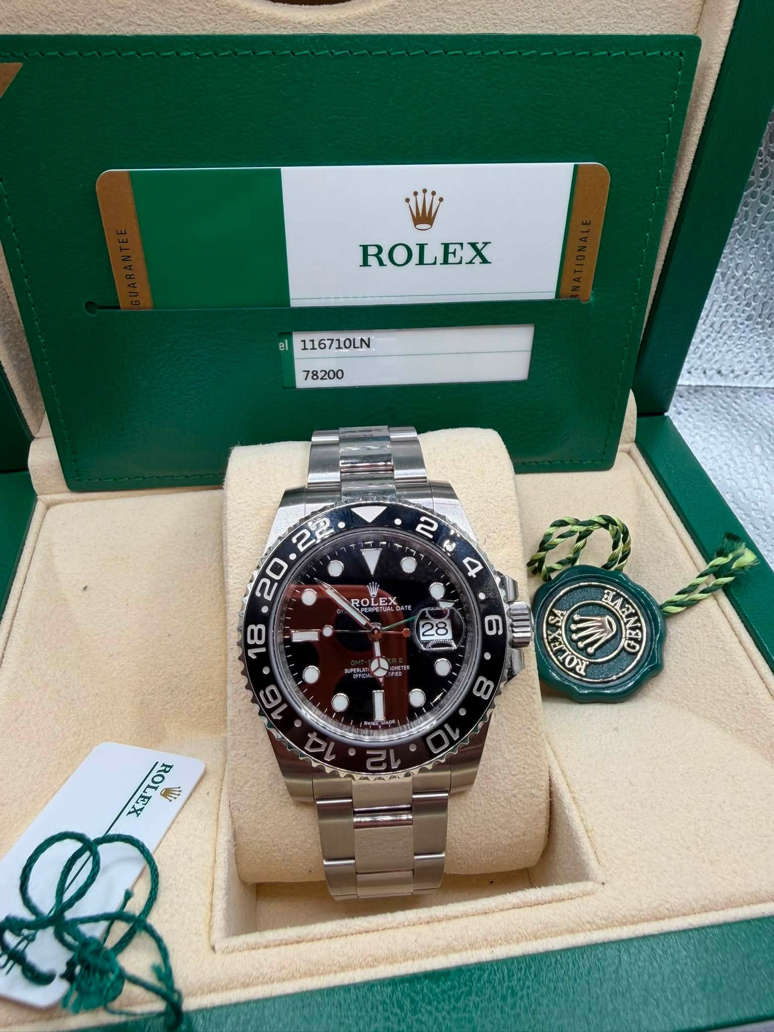 May be an image of wrist watch and text that says 'ROLEX el el 116710LN 78200 2 ಜಿ 4 ROLEX ROLEX . SA ביי, ઓો SLA HAENE 8 ×a 삼원 L'