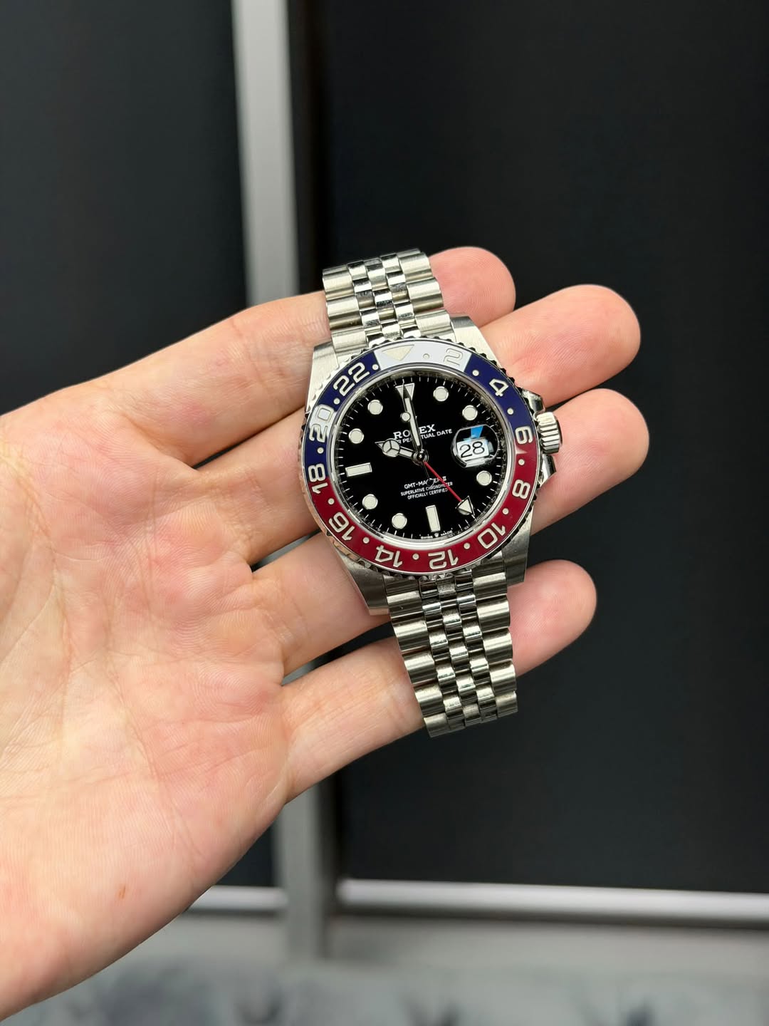 May be an image of wrist watch and text