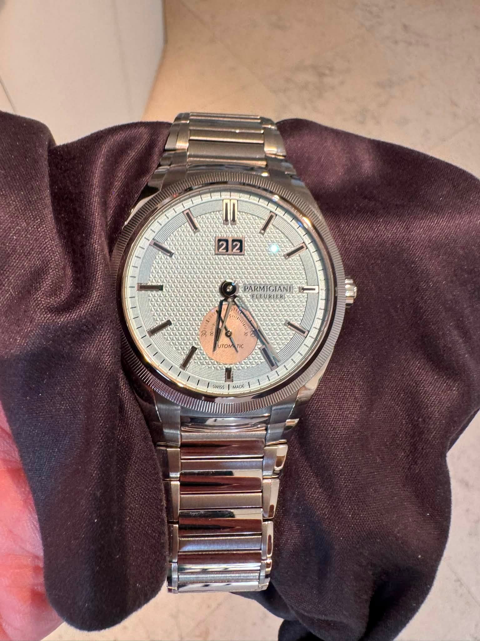 May be an image of wrist watch and text