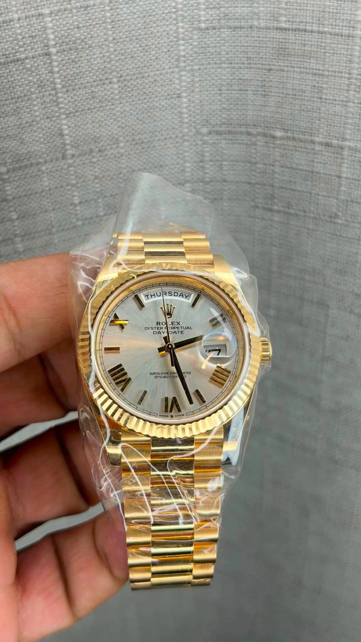May be an image of wrist watch and text