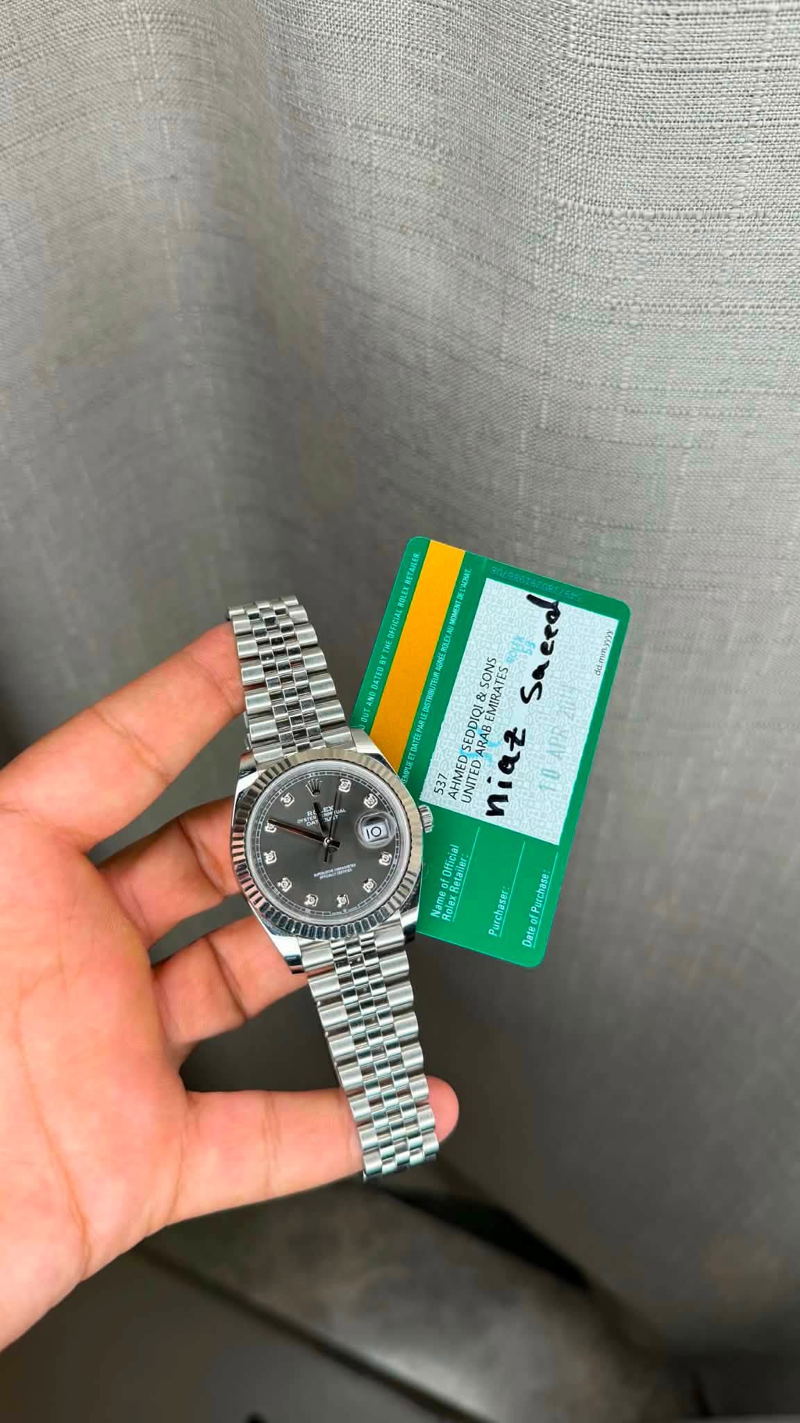 May be an image of wrist watch and text