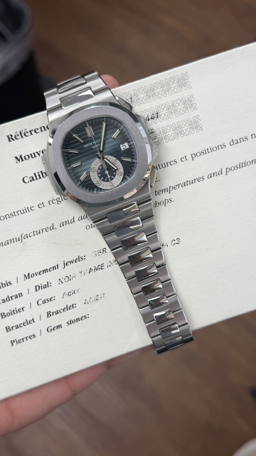 May be an image of wrist watch and text
