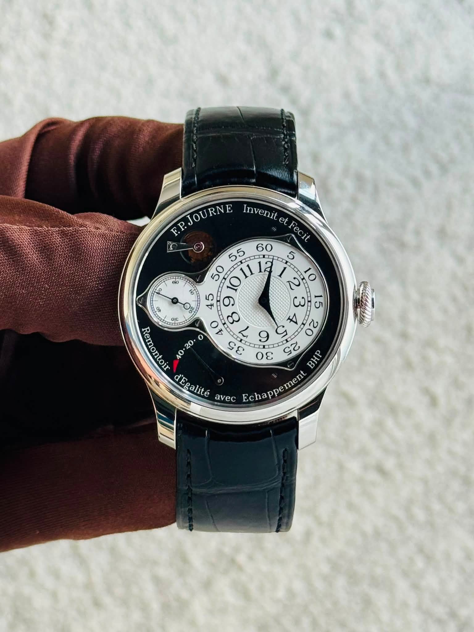 May be an image of wrist watch and text that says 'it F.PJOURNE Invenit 55 60 50 1a و ๑ 15 o र 20 ዐቱ L 9 σε :20 ن က 25 BHP d'Eealité avec Echappement'