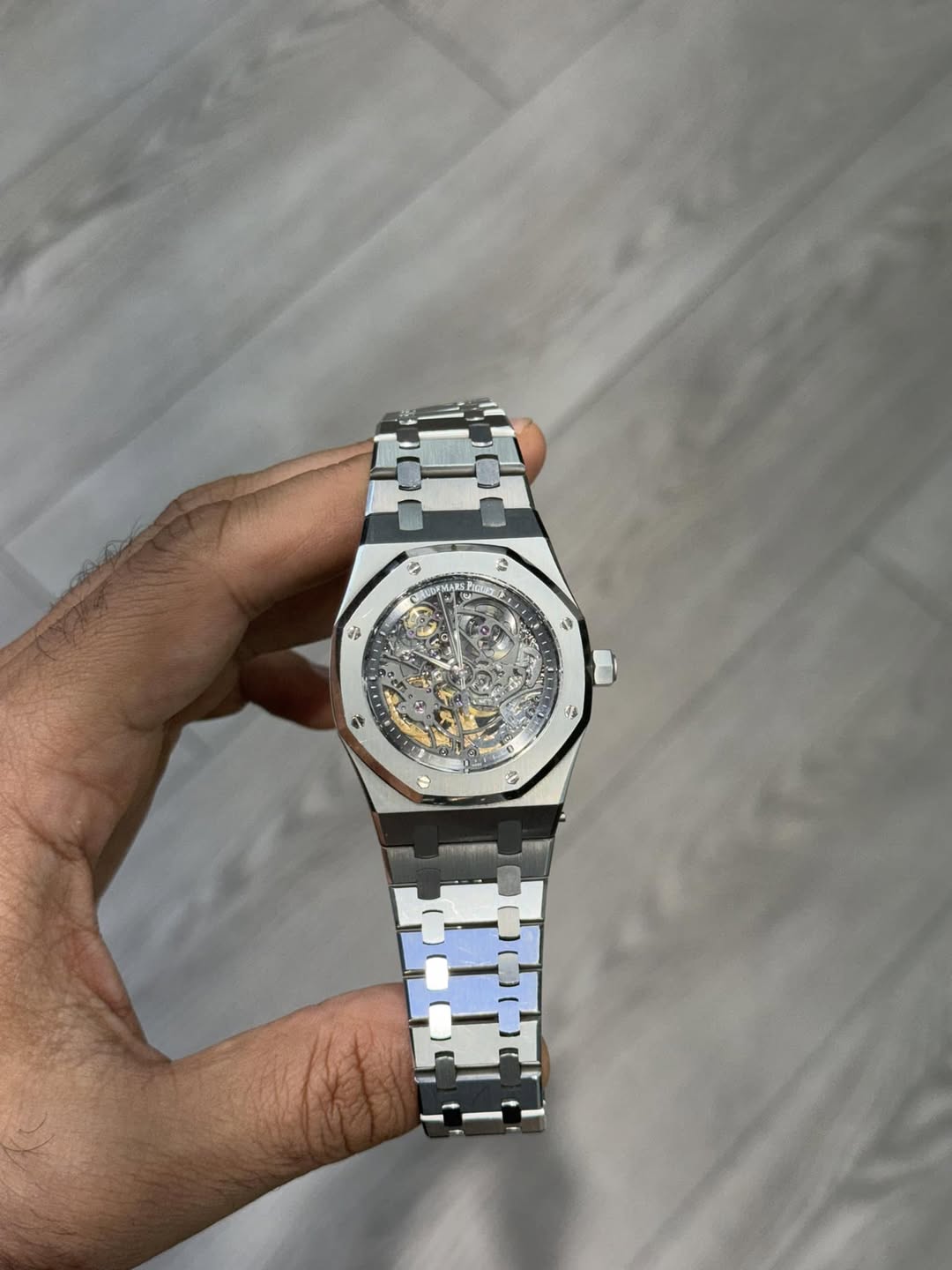 May be an image of wrist watch and text