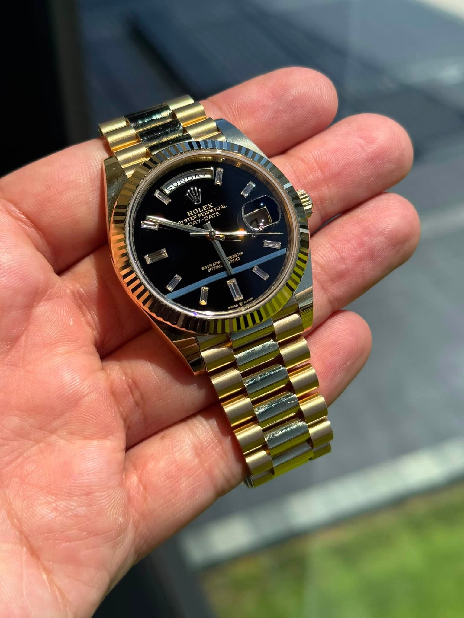 May be an image of wrist watch and text