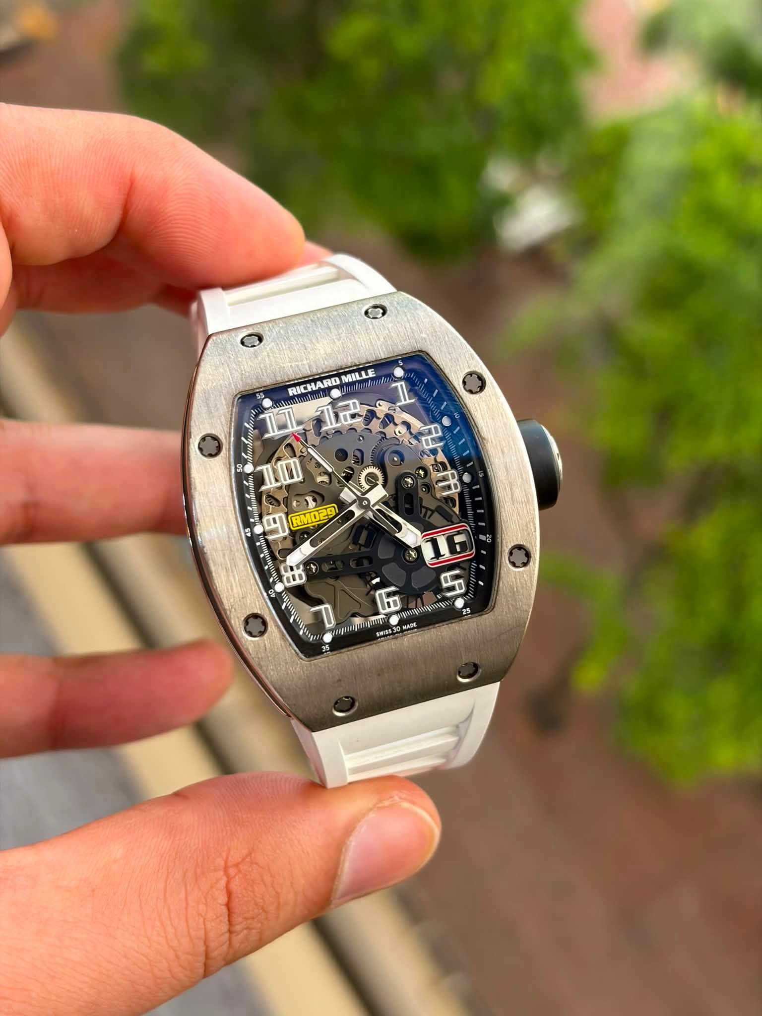 May be an image of wrist watch and text that says 'RICHARD MILLE IL ម IOI 円 RM029 16 - 5 N 1 sigut RIRA MADE'