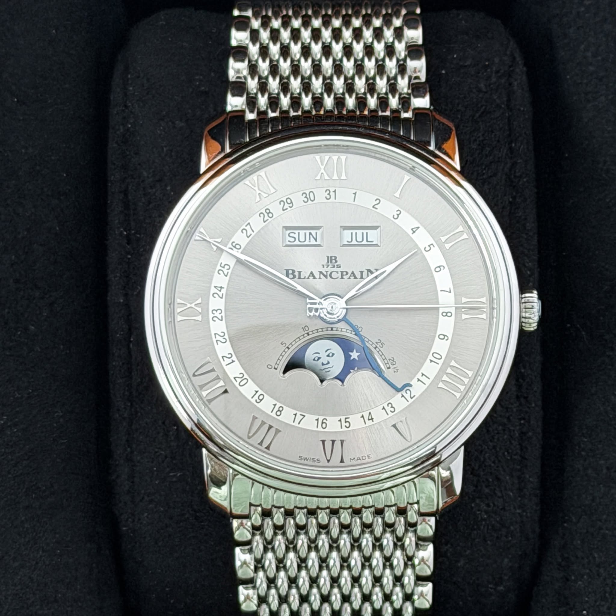 May be an image of wrist watch and text that says '2 3 JUL JB BLANCPAIN 5 6 XI 29 30 31 XII 28 27 SUN IX 23 8 INT ඇ 9 IIIA 06 1 O0 IIII L 61 یے TIA ထ SWISs VI MADE 5 TITH 20'
