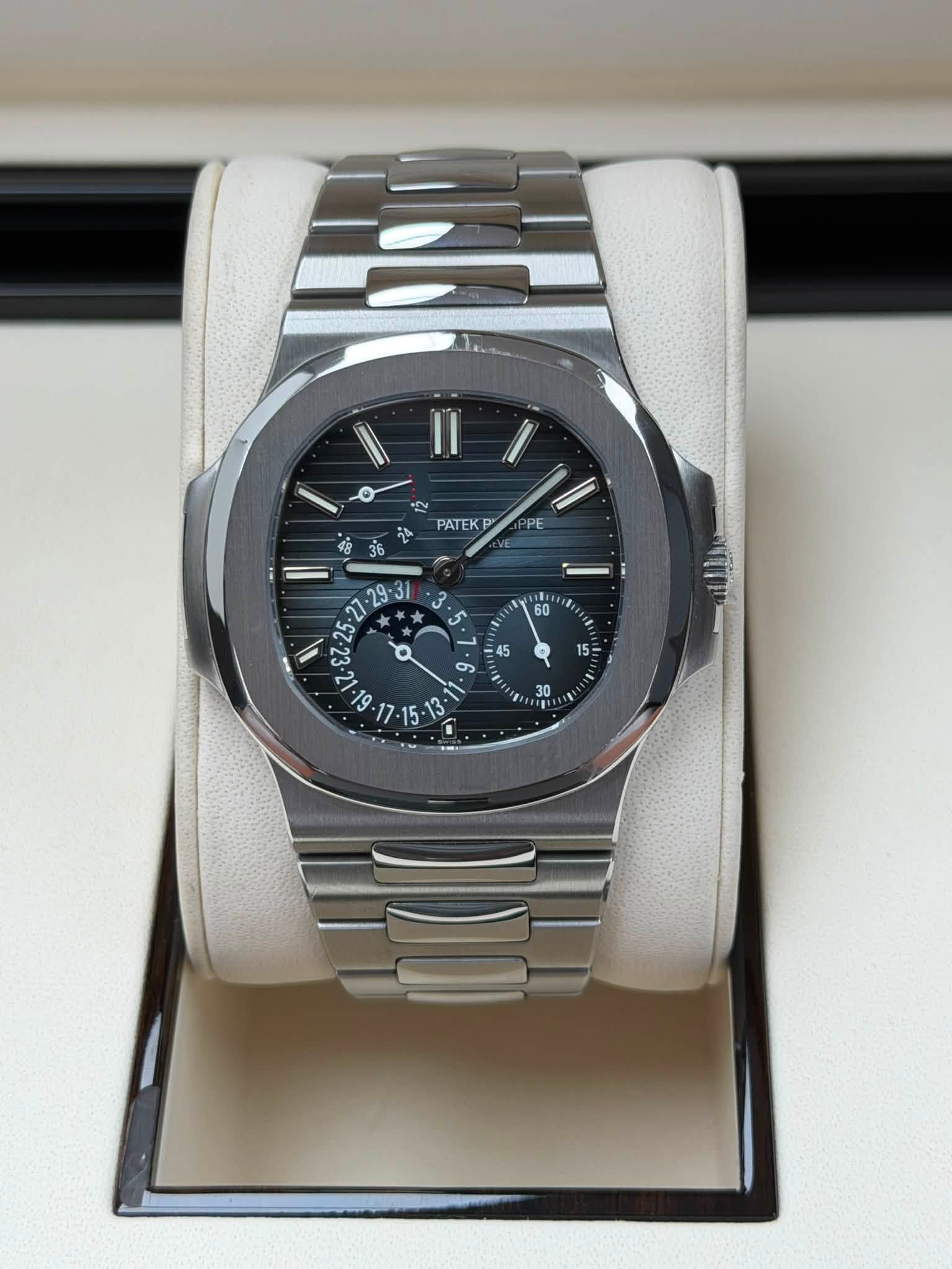 May be an image of wrist watch and text that says 'o 12 PATEK p ឆ្នំ PE = نه a တ - '