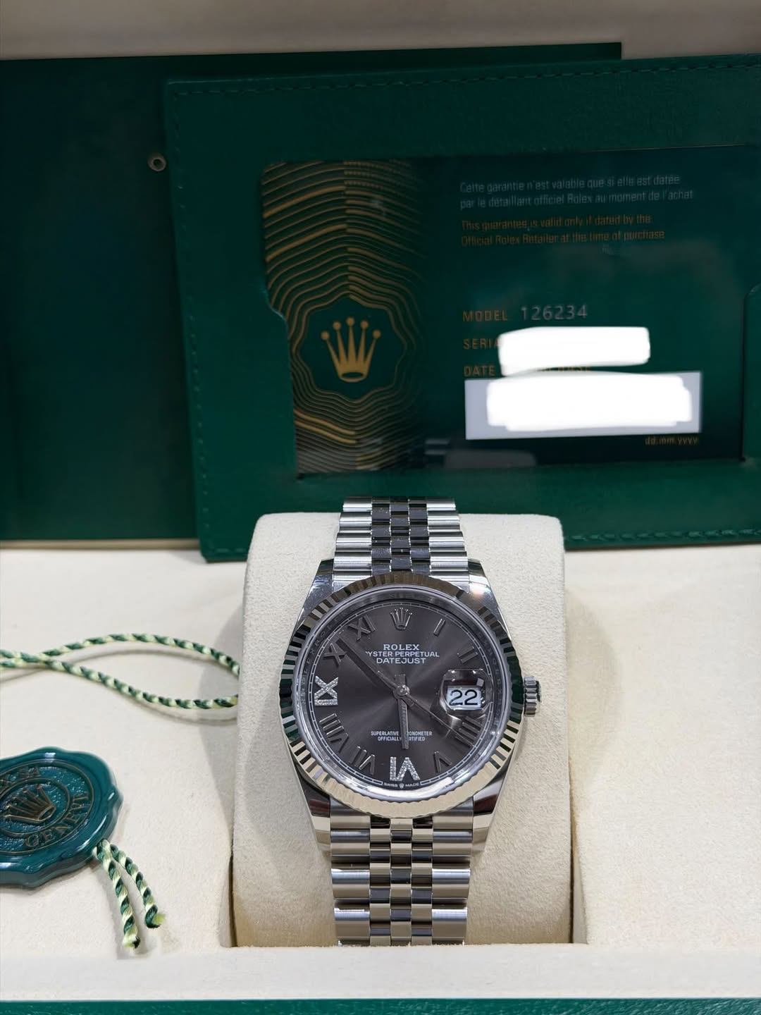 May be an image of wrist watch and text