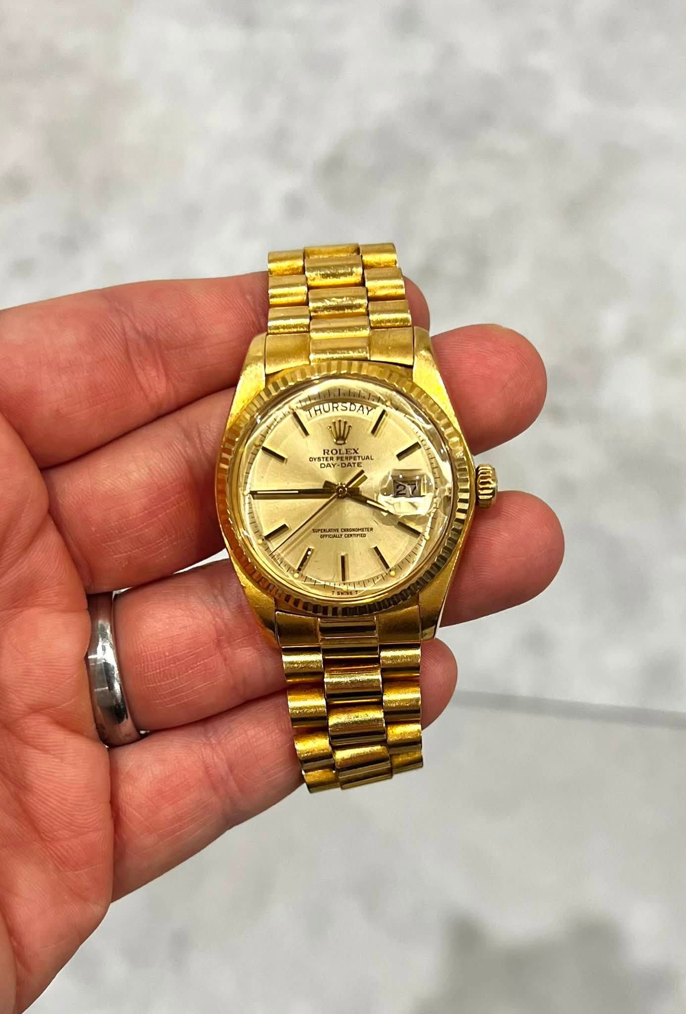 May be an image of wrist watch and text