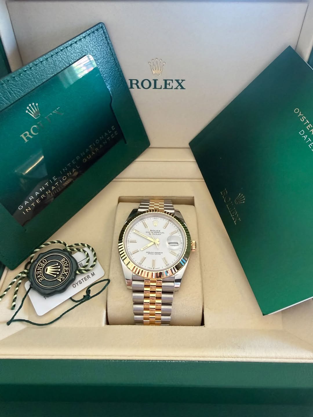 May be an image of wrist watch and text