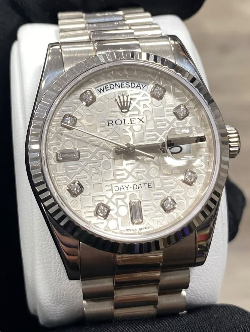 May be an image of wrist watch and text that says 'WEDNESDAY M ROLEX شد NTON JIDII EXROLE TDAY-DATE TDAY DATE 0F0 aWWMS MADE U'