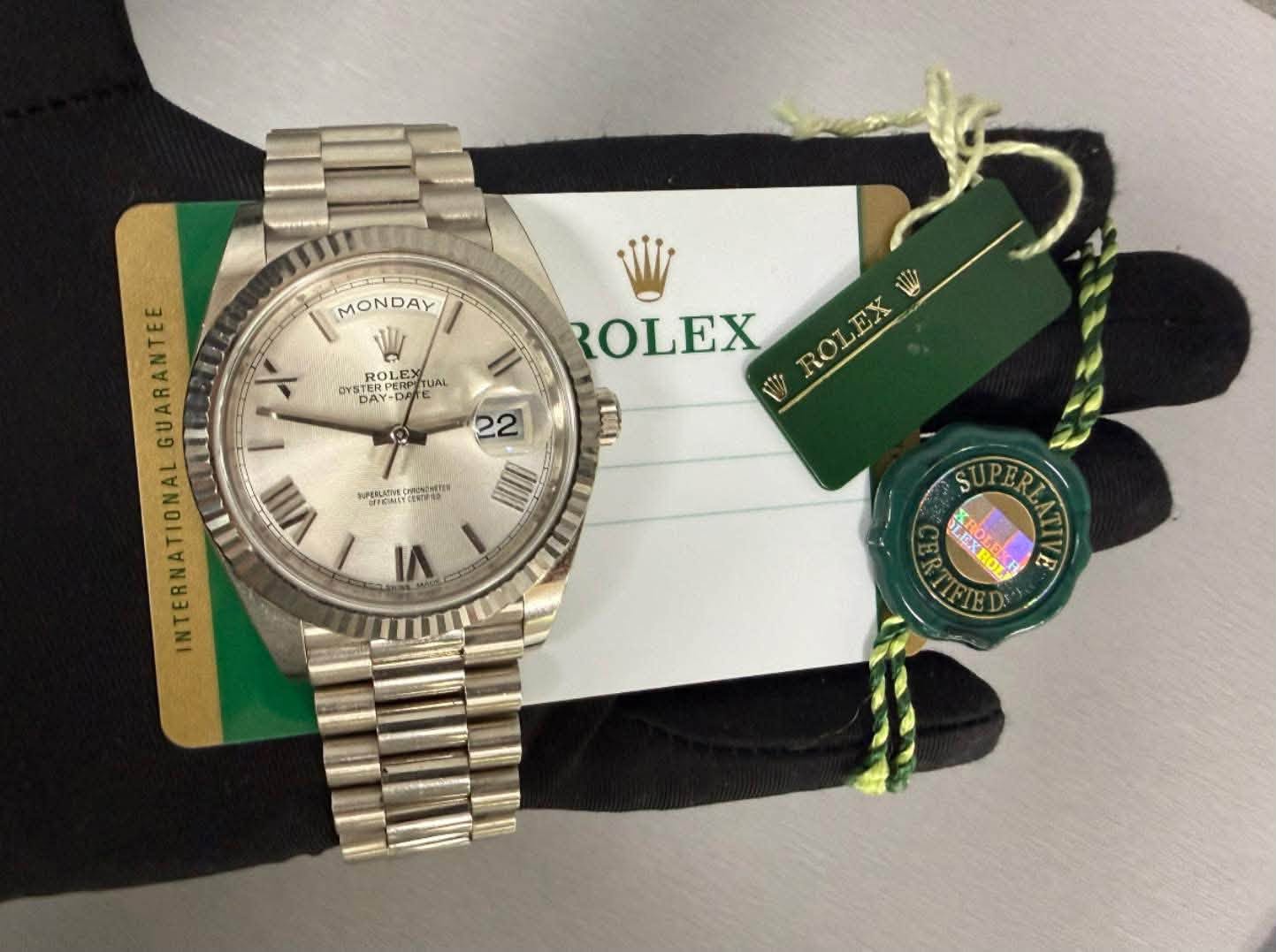 May be an image of wrist watch and text