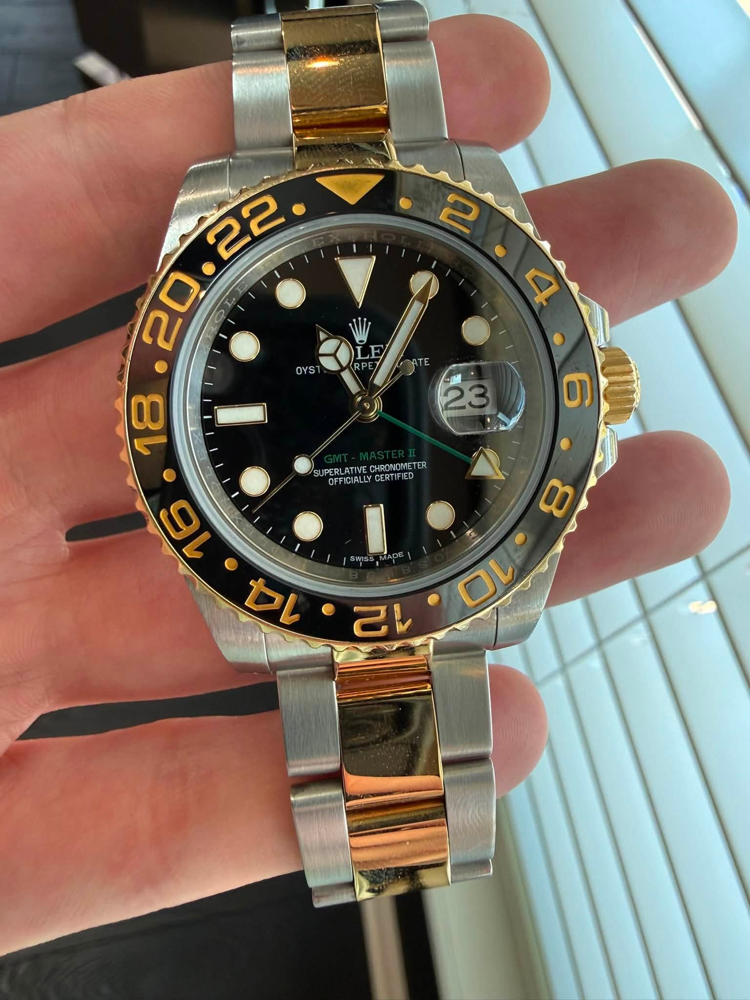 May be an image of wrist watch and text