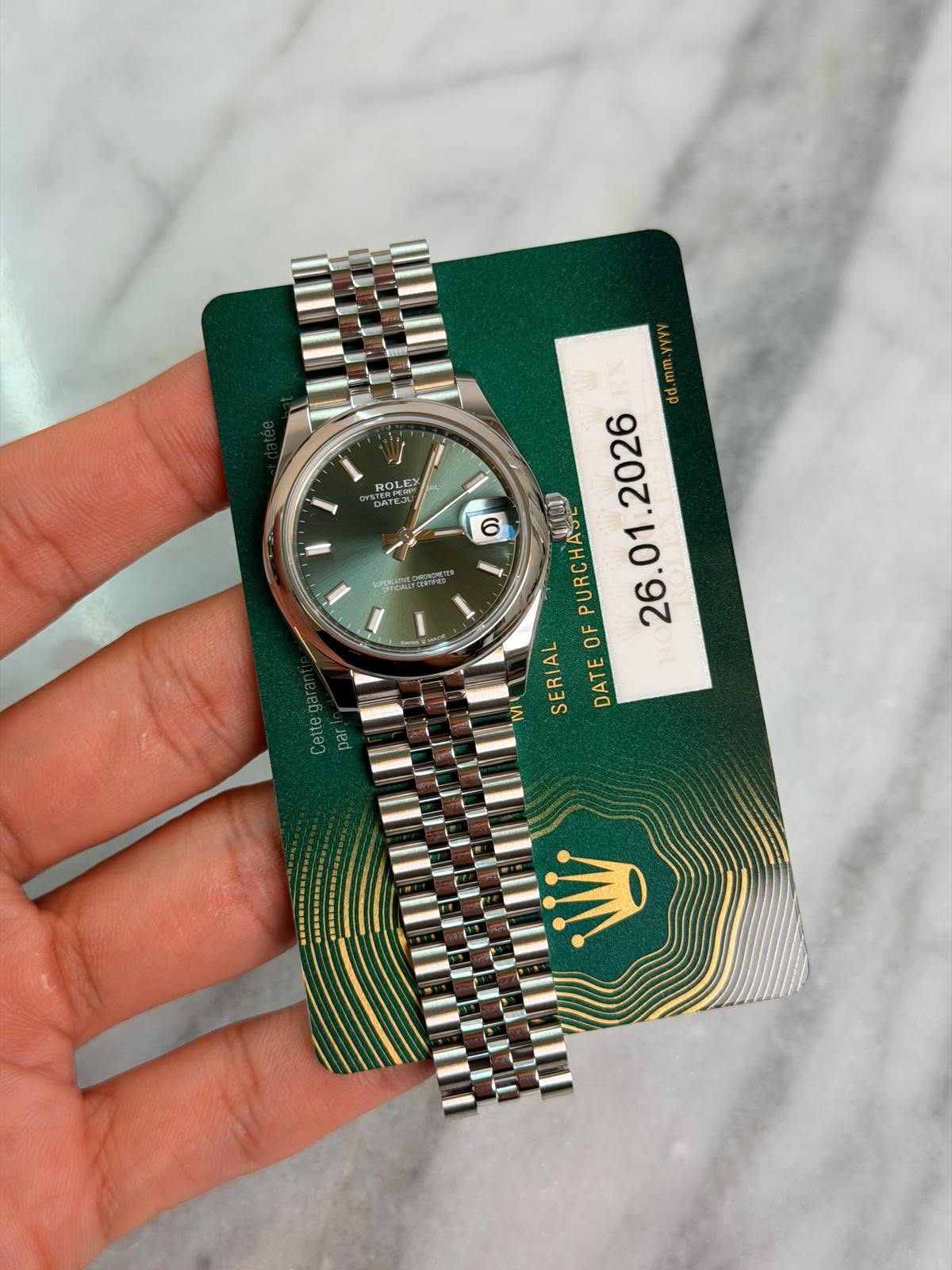 May be an image of wrist watch and text that says 'ROLE DATES STERPEO DATEJL 6 O PE upc d.mm.yyyy ۷۲۱۱۱ dd PURCHAS OF SERIAL DATE Cettegar pa'
