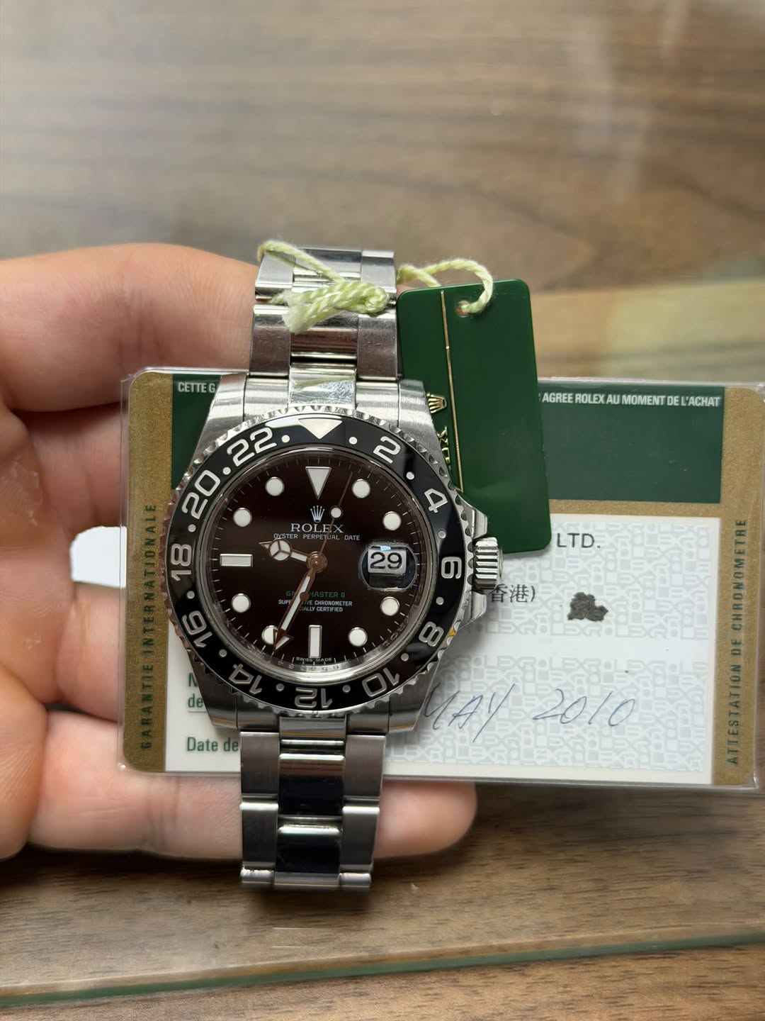 May be an image of wrist watch and text