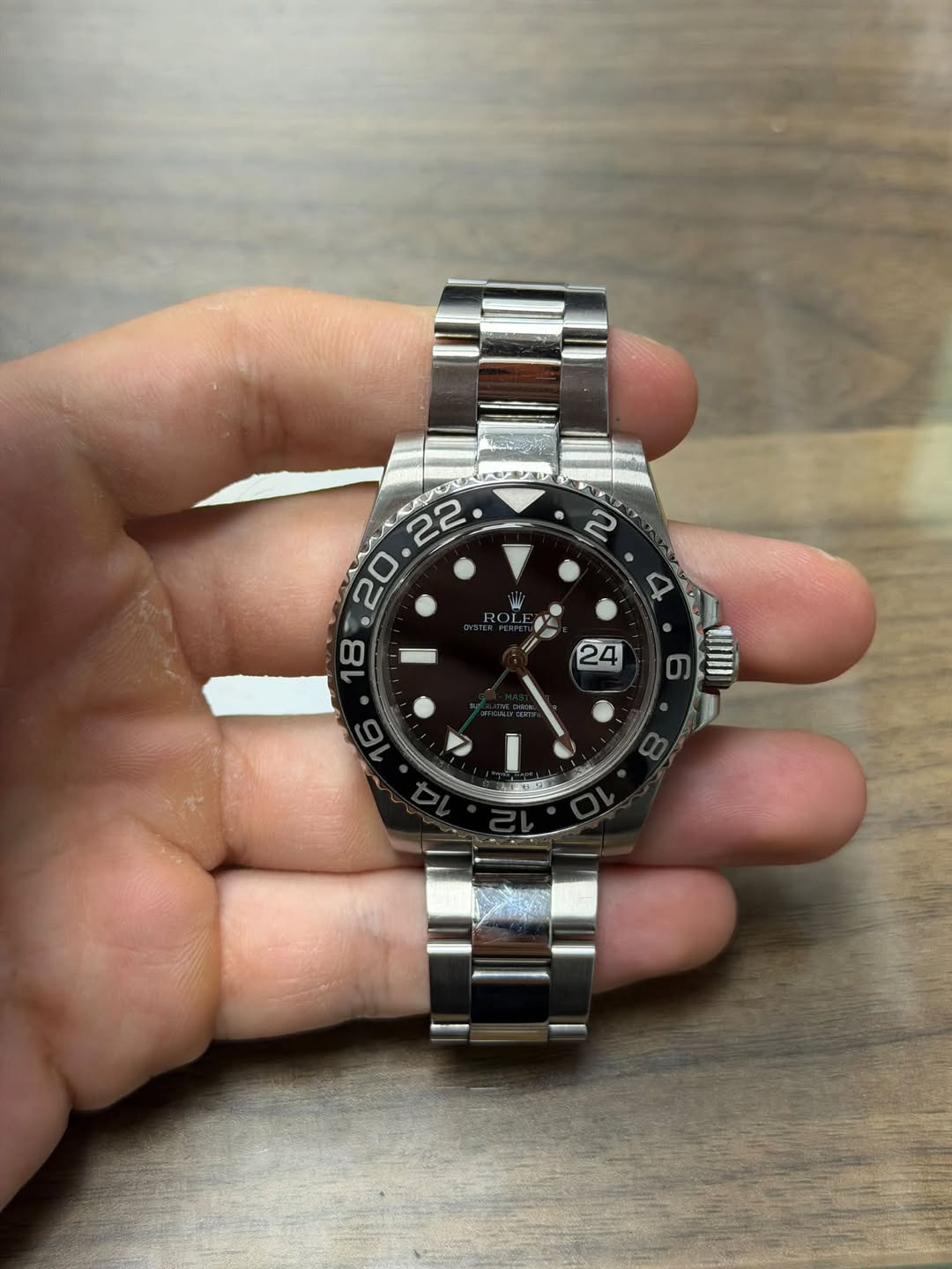 May be an image of wrist watch and text