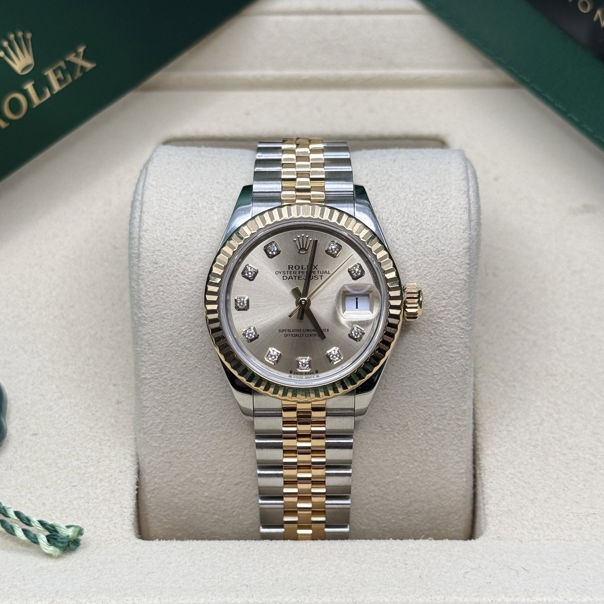 May be an image of wrist watch and text