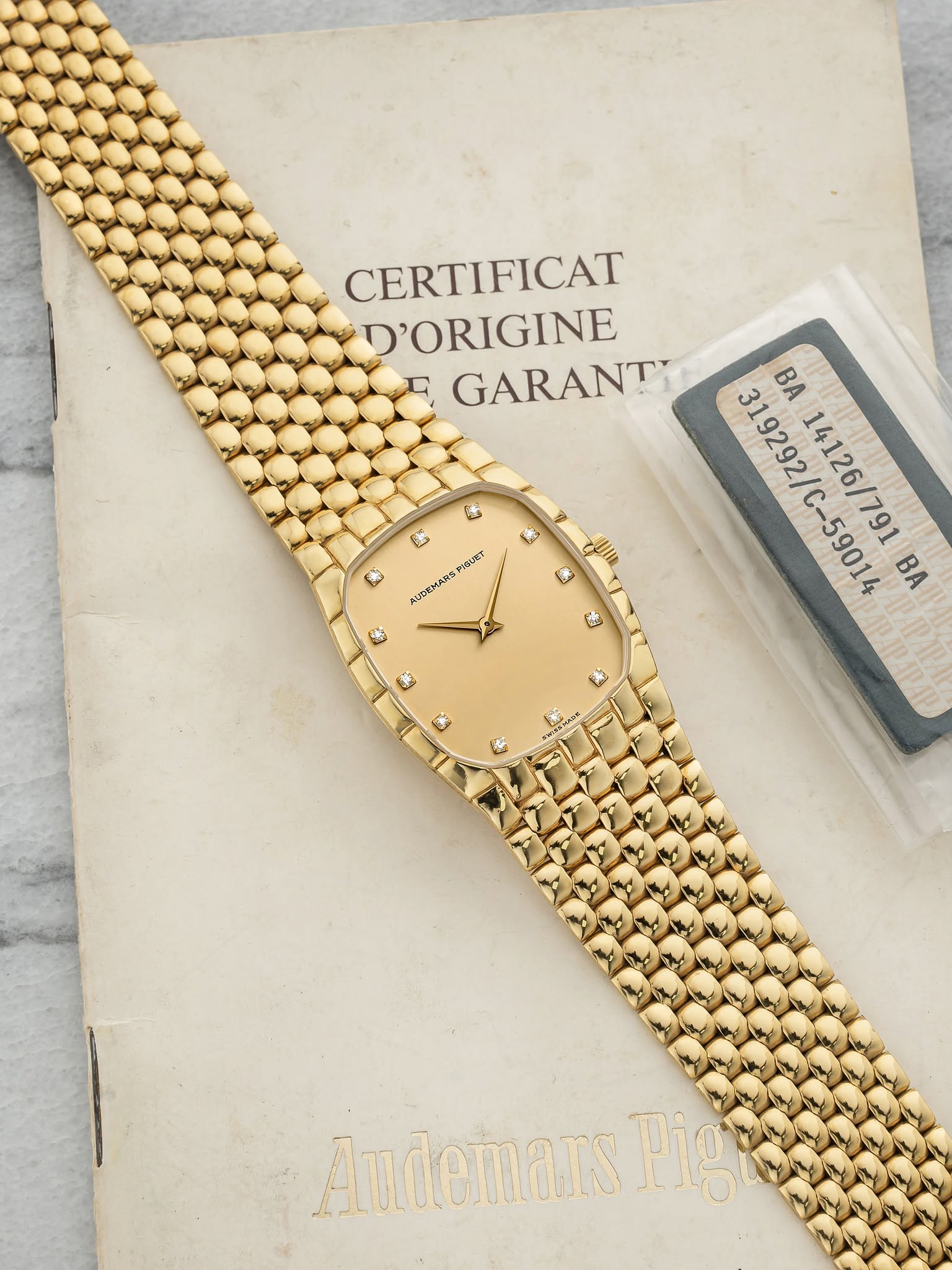 May be an image of wrist watch and text