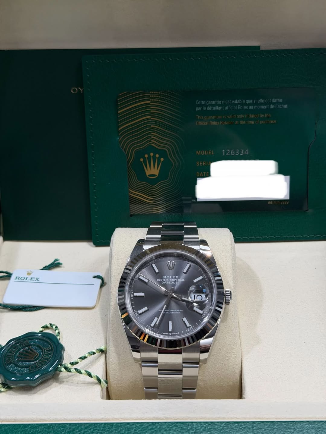 May be an image of wrist watch and text